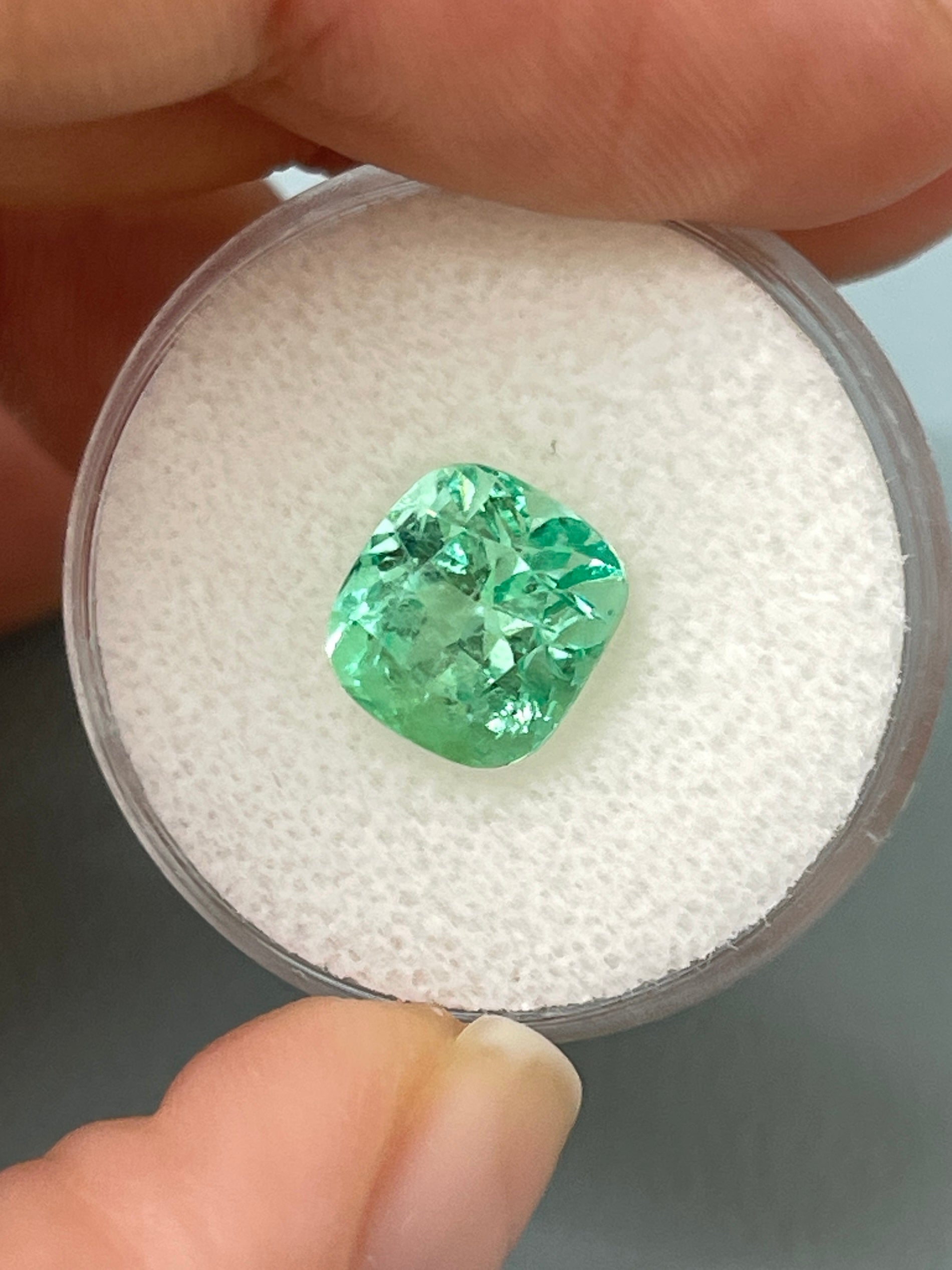 Lustrous 3.42 carat light yellowish green Colombian emerald in cushion cut, natural loose gemstone from JR Colombian Emeralds.