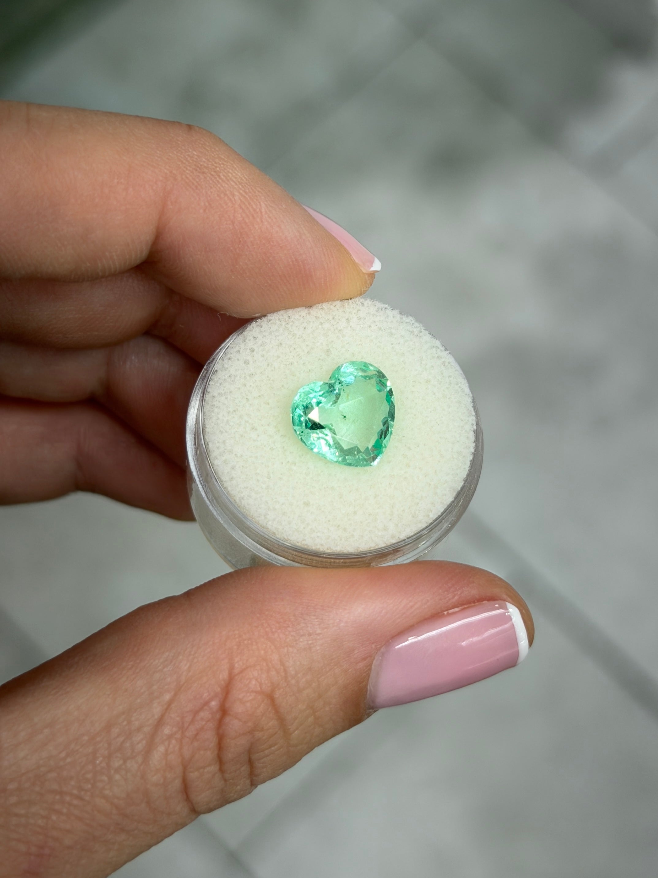 3.44 carat light bluish-green Colombian emerald loose heart-shaped gemstone with natural freckles, 10x11 portrait cut by JR Colombian Emeralds
