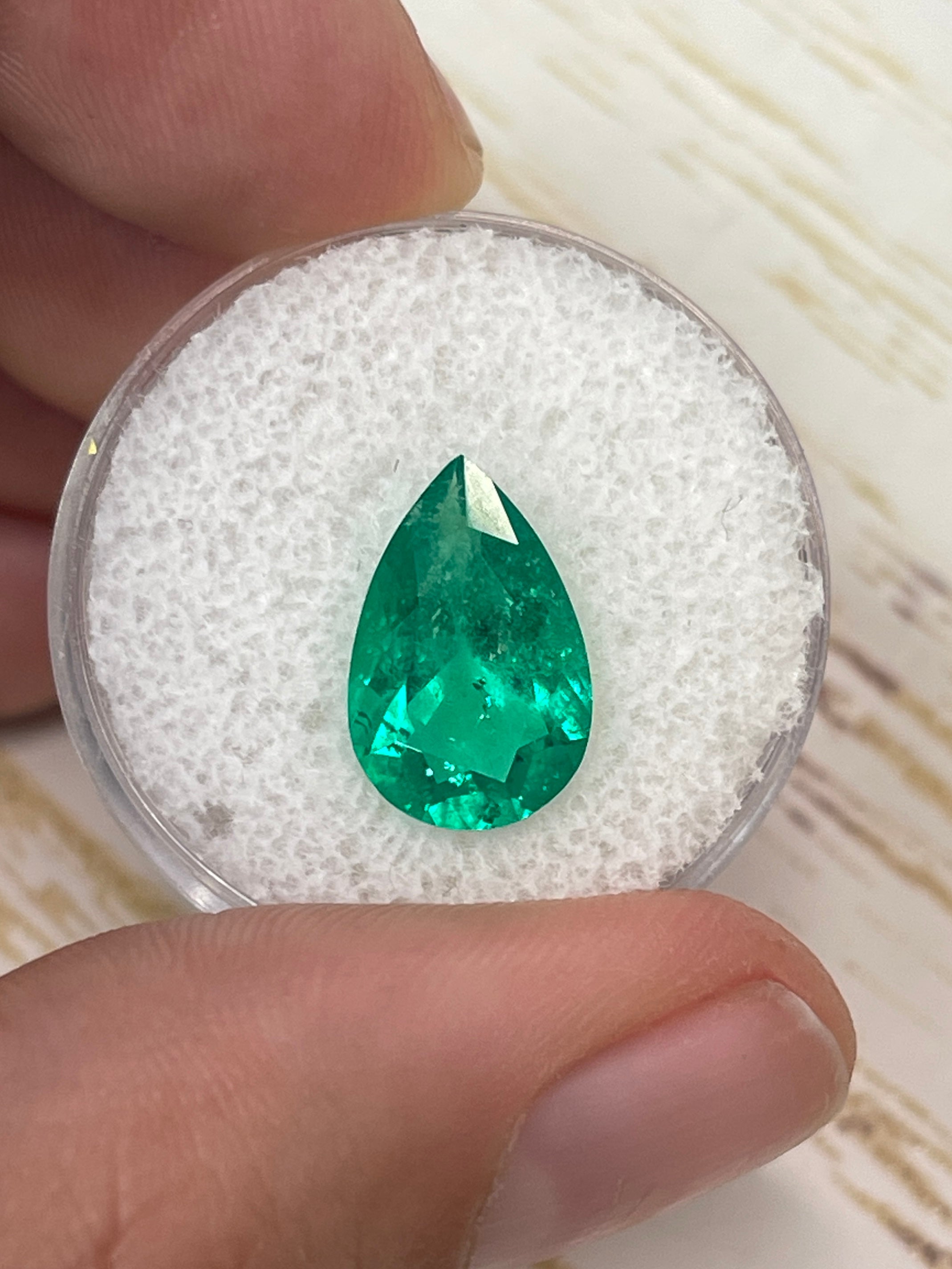 Fine 3.47 carat Colombian emerald loose gemstone in pear cut, vibrant green color, from JR Colombian Emeralds.