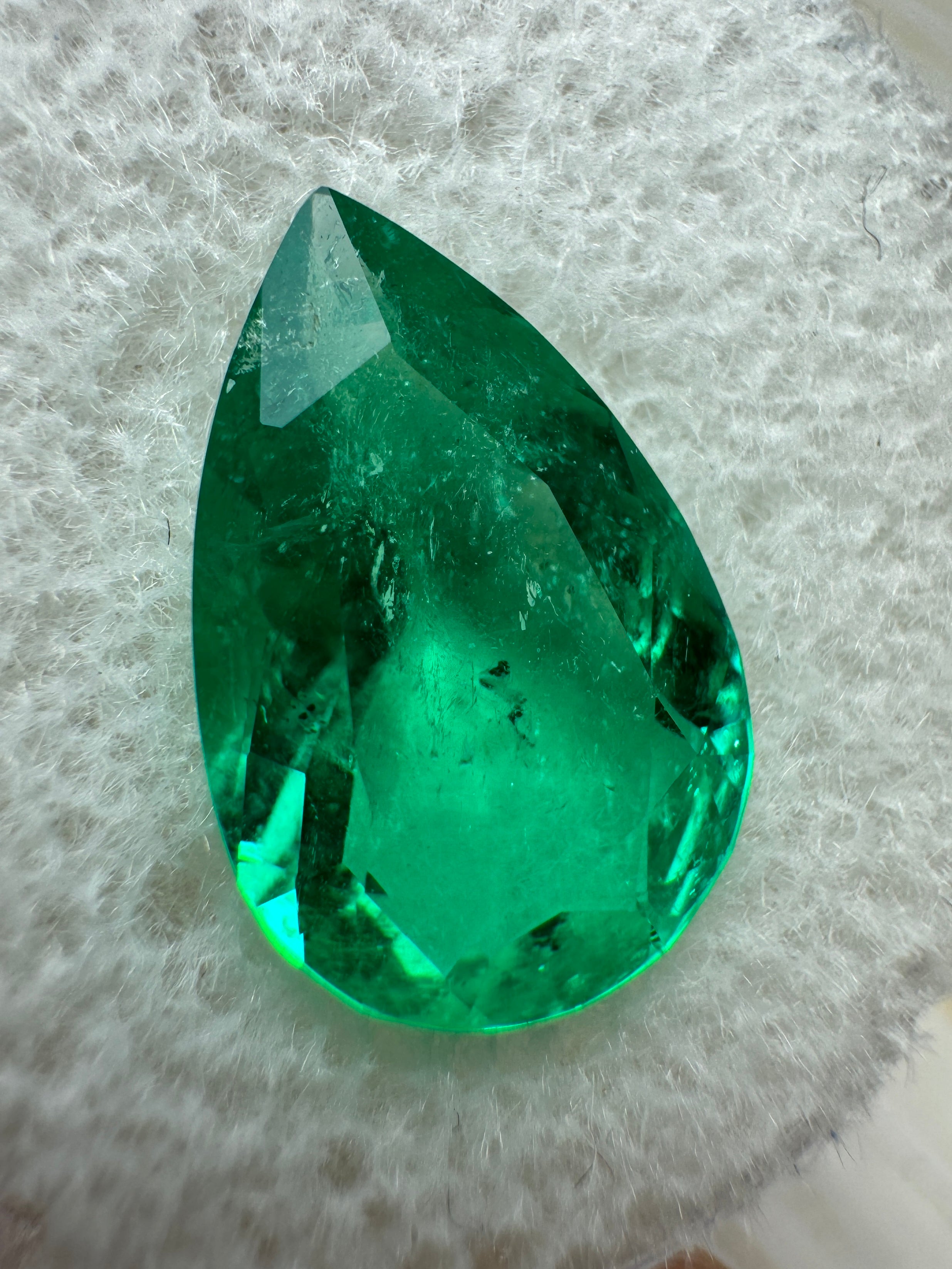 3.47 carat 14x9mm pear-cut natural Colombian emerald loose gemstone by JR Colombian Emeralds, showcasing vibrant green color and clarity.
