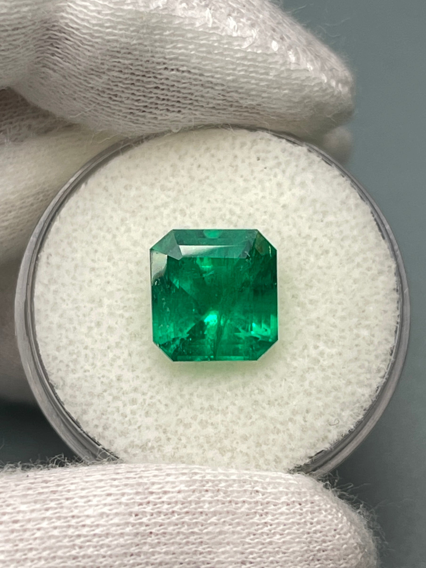 Vivid 3.49 Carat Muzo green Colombian emerald loose gemstone with Asscher cut, natural and vibrant, from JR Colombian Emeralds.