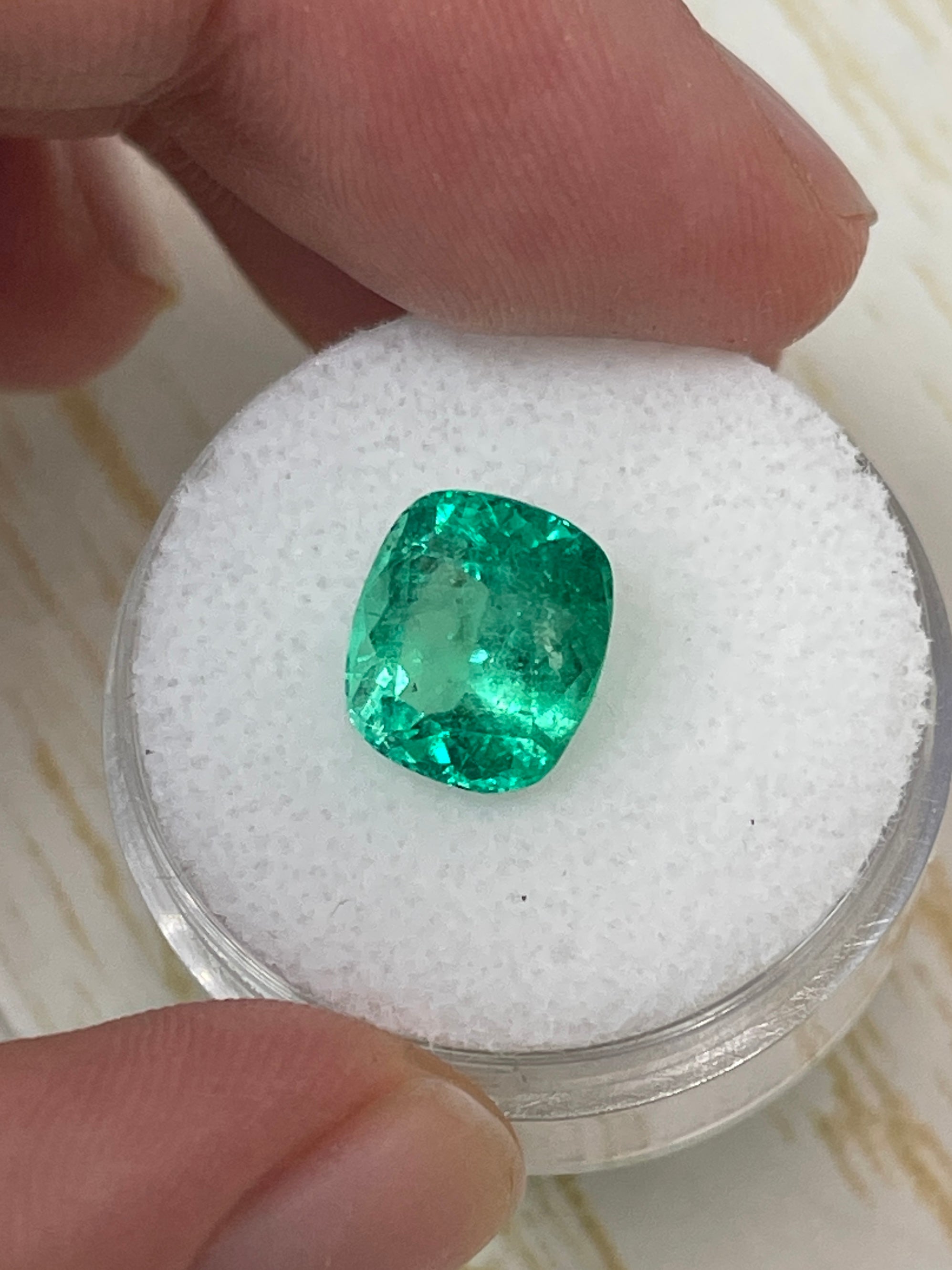 Natural 3.50 carat yellowish green Colombian emerald loose cushion cut gemstone by JR Colombian Emeralds.