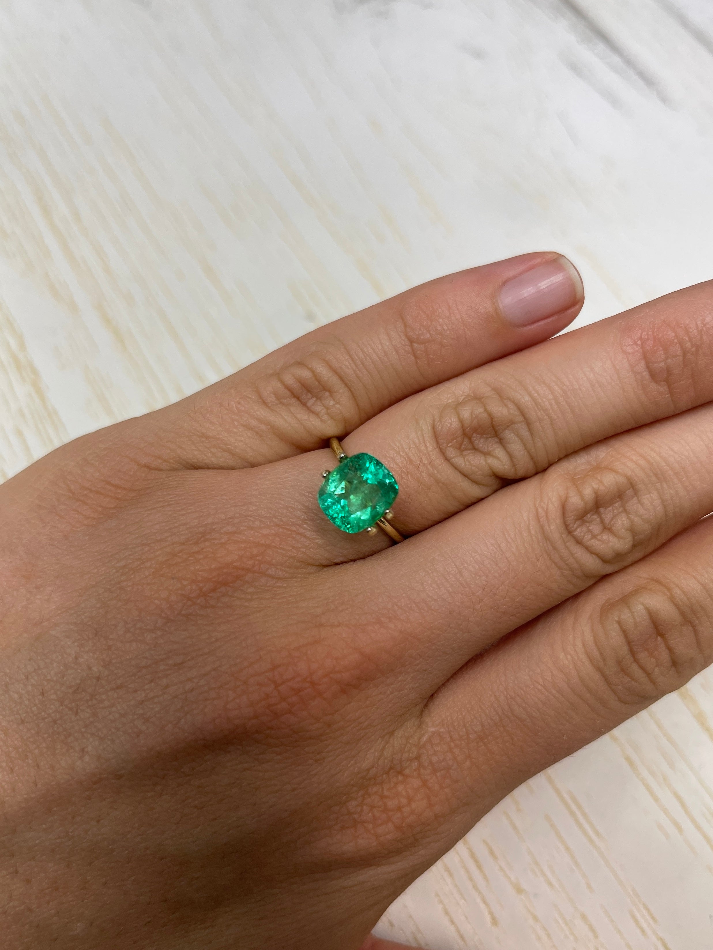 Yellowish green 3.50 carat cushion cut Colombian emerald loose gemstone, natural with vibrant color and clarity.