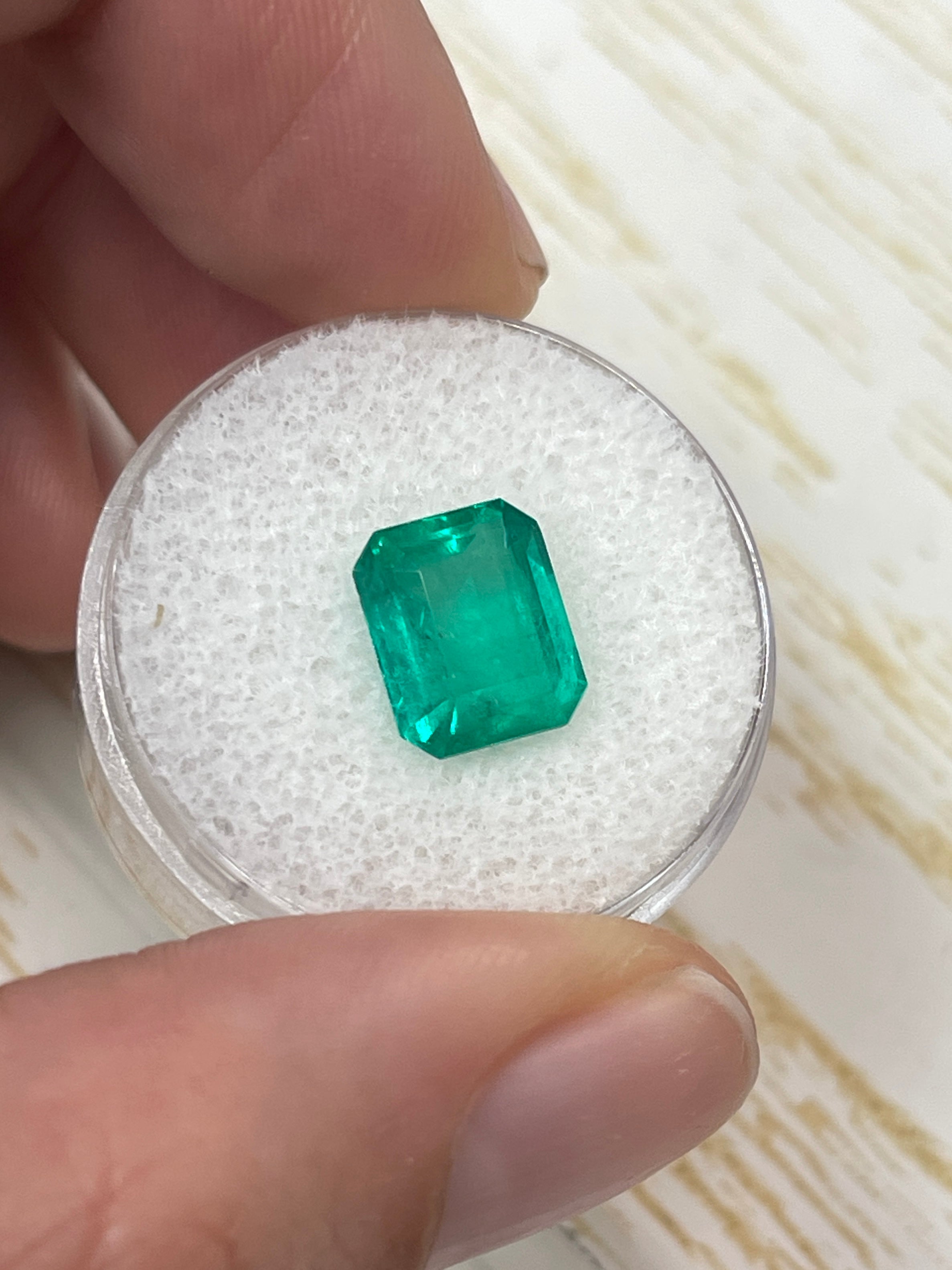 Medium bluish green 3.53 carat Colombian emerald cut loose gemstone from JR Colombian Emeralds, showcasing rich color and clarity.