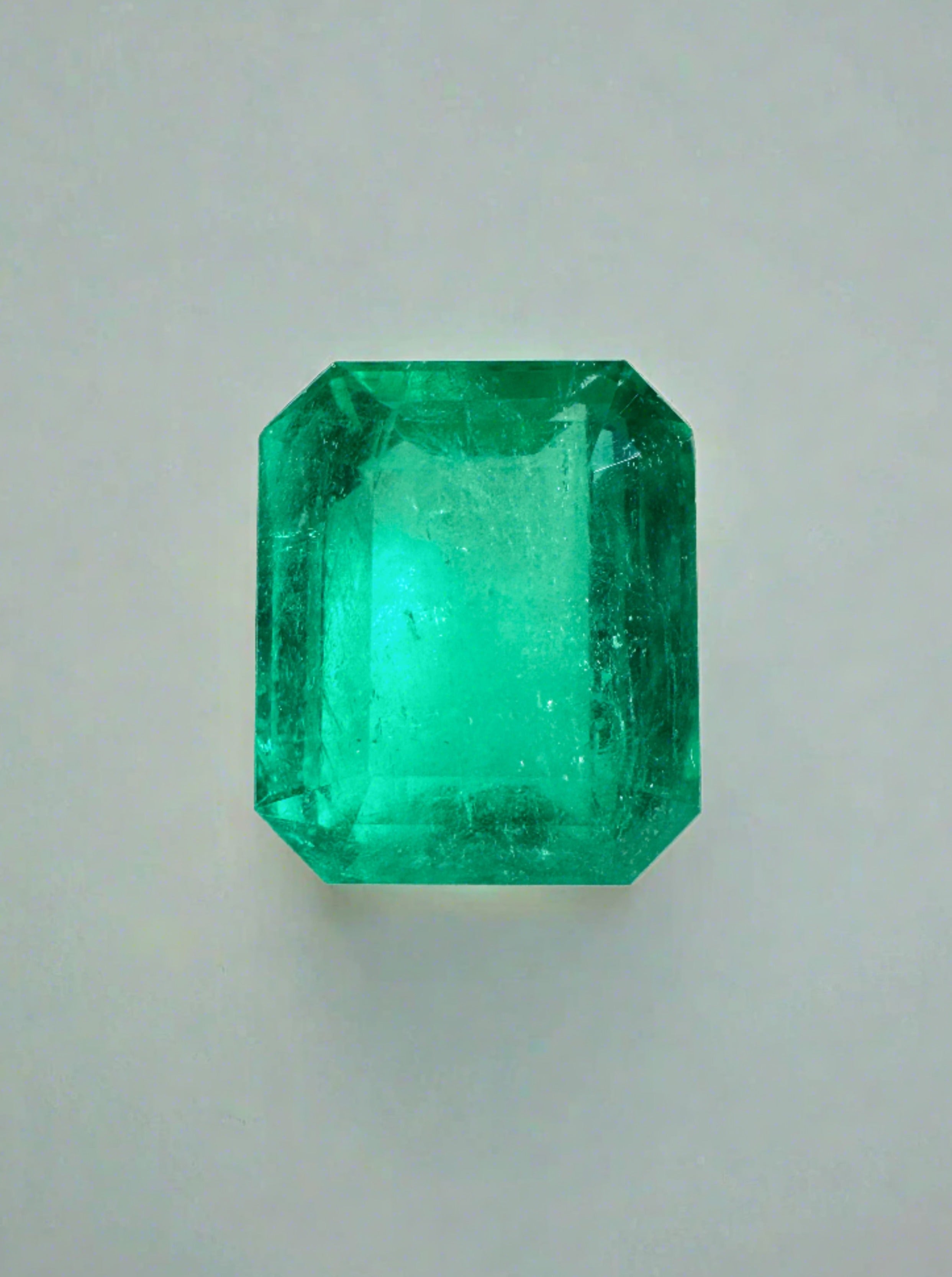 3.53 carat medium bluish green Colombian emerald loose gemstone in emerald cut, showcasing vibrant color and clarity.