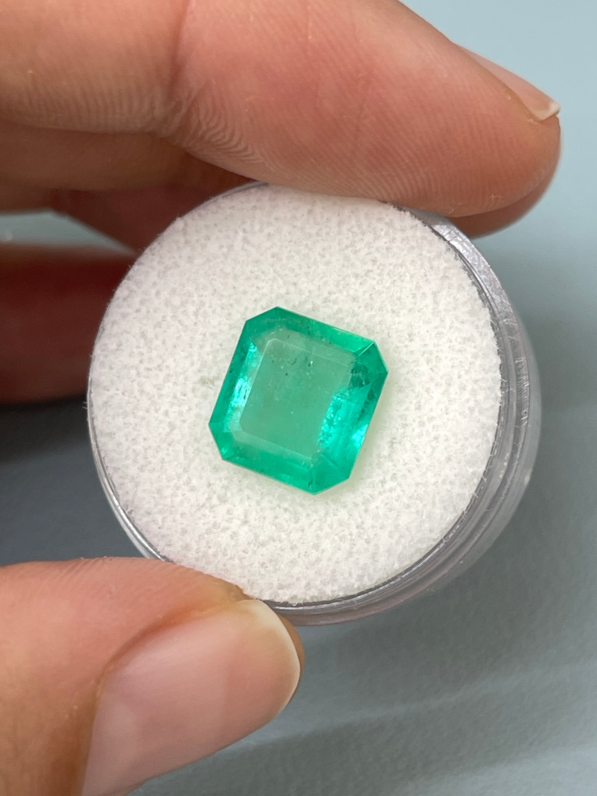 Loose 3.59 carat spring green Colombian emerald in Asscher cut, showcasing vibrant color and clarity, from JR Colombian Emeralds.