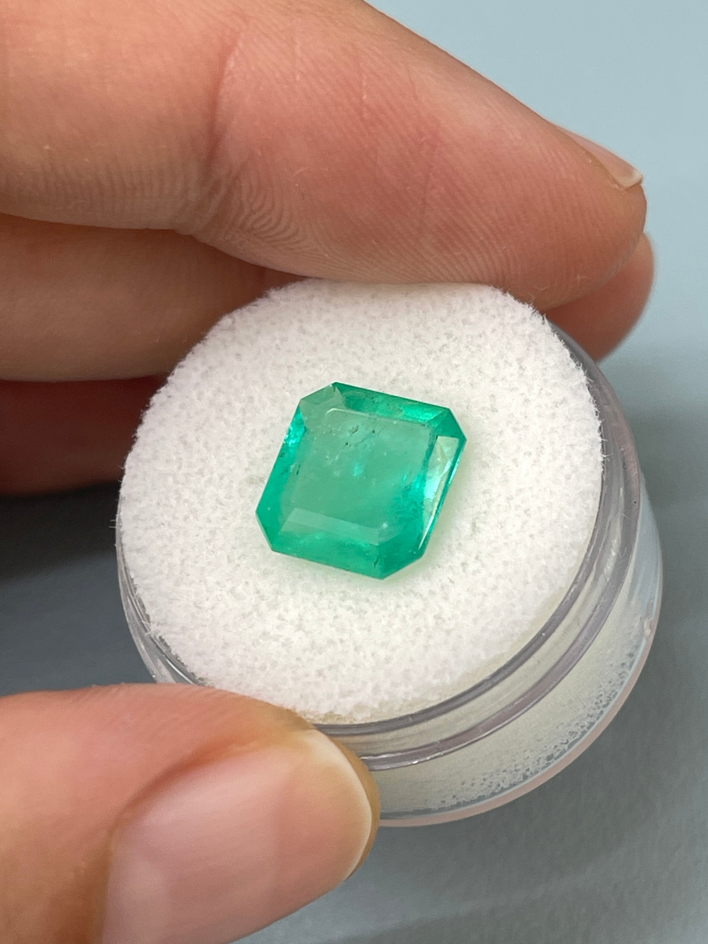 3.59 carat spring green Colombian emerald loose gemstone in an Asscher cut, showcasing vibrant color and clarity.