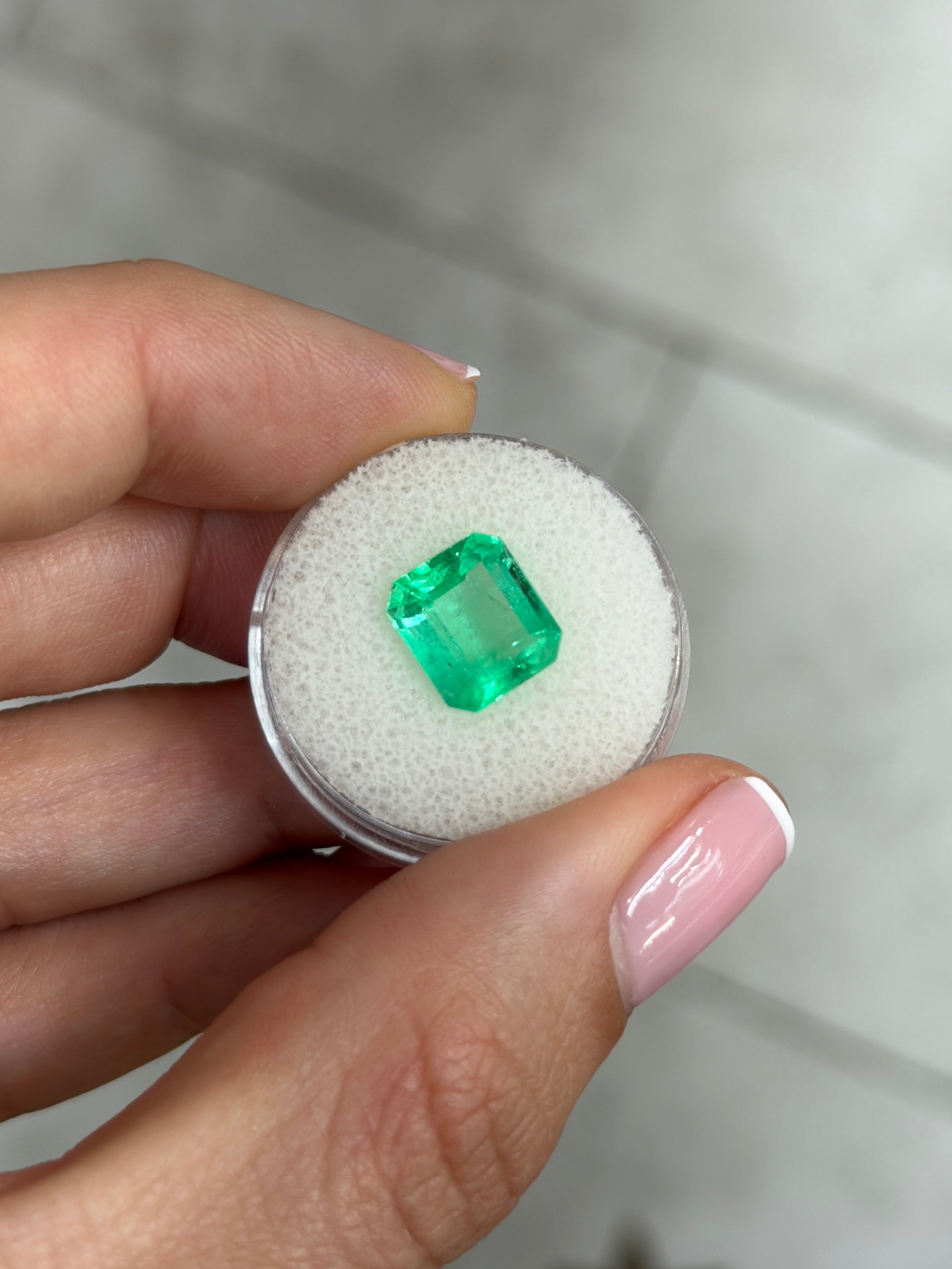 3.72 carat spring green Colombian emerald in an emerald cut, natural loose gemstone from JR Colombian Emeralds.