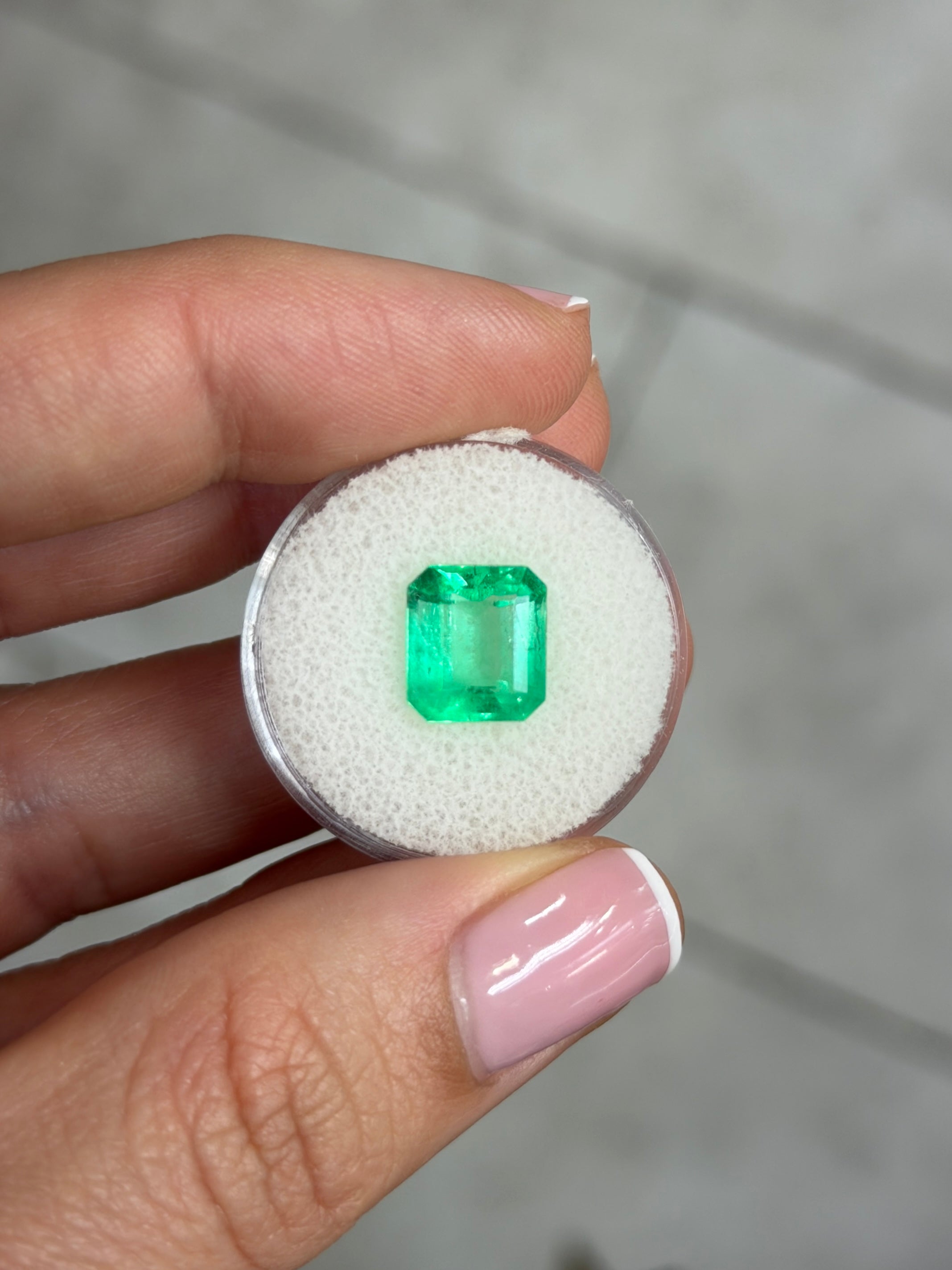 Bright 3.72 carat spring green Colombian emerald loose gemstone in an emerald cut from JR Colombian Emeralds.