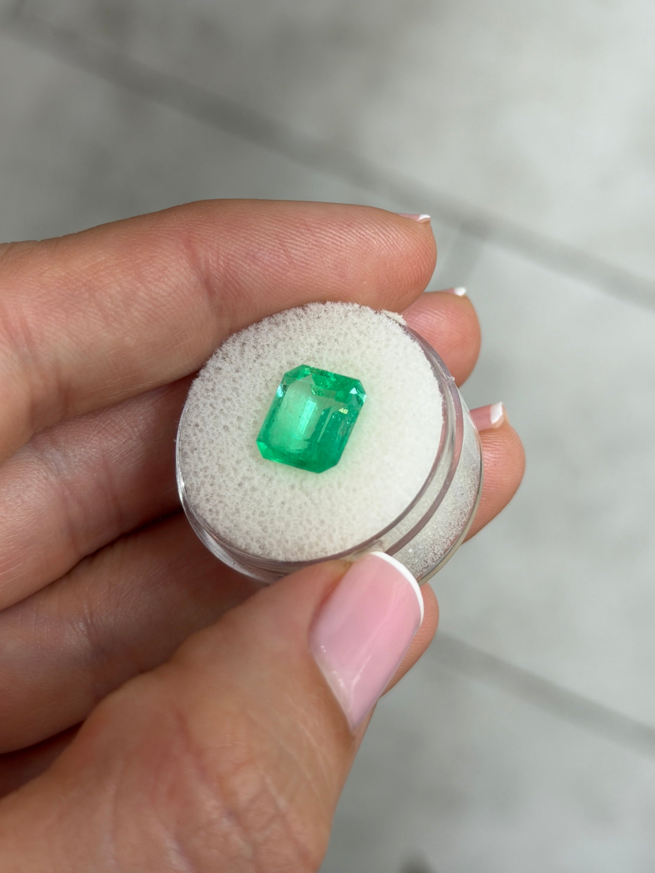 3.72 carat natural Colombian emerald in 10x9mm emerald cut with vibrant spring green color, loose gemstone from JR Colombian Emeralds.