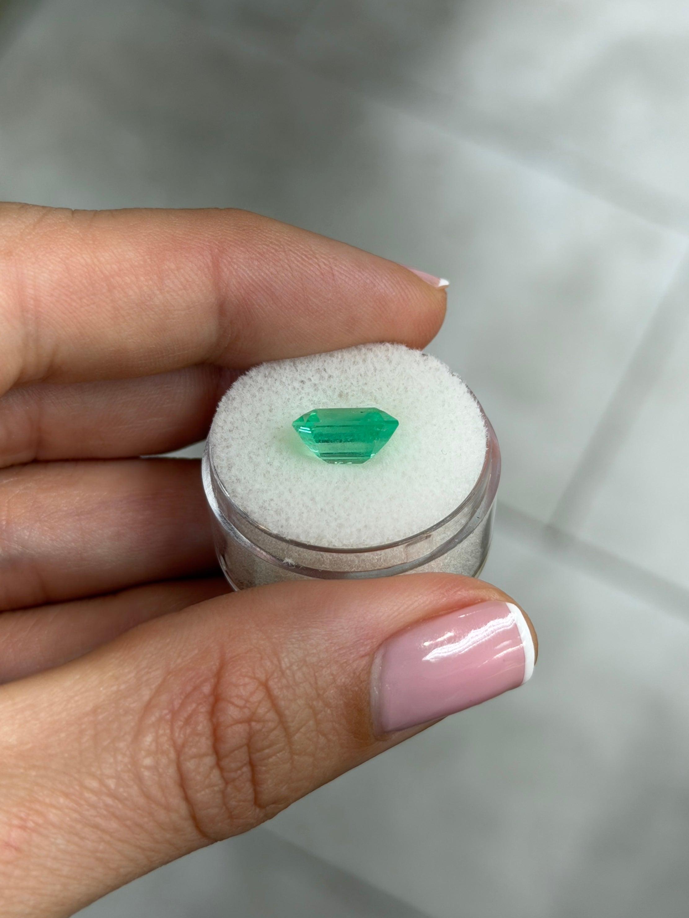 Natural 3.72 Carat 10x9 mm spring green Colombian emerald loose gemstone in emerald cut, showcasing vibrant color and clarity.