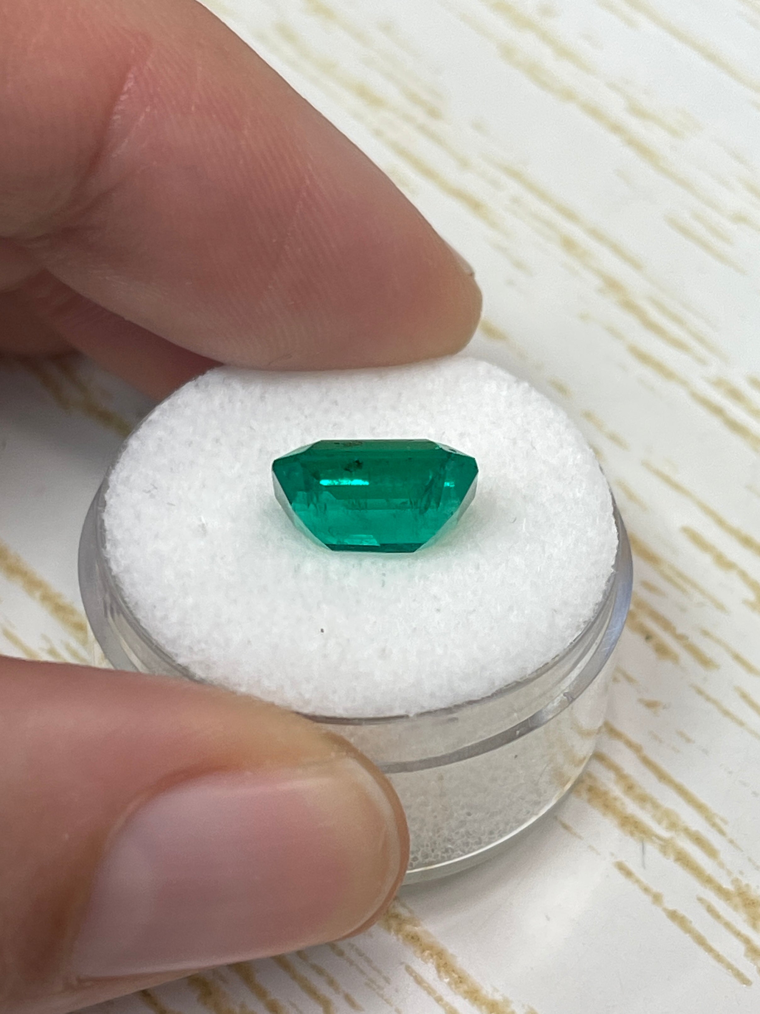 AAA+ 3.72 carat natural Colombian emerald loose gemstone in an emerald cut with green freckles, from JR Colombian Emeralds.
