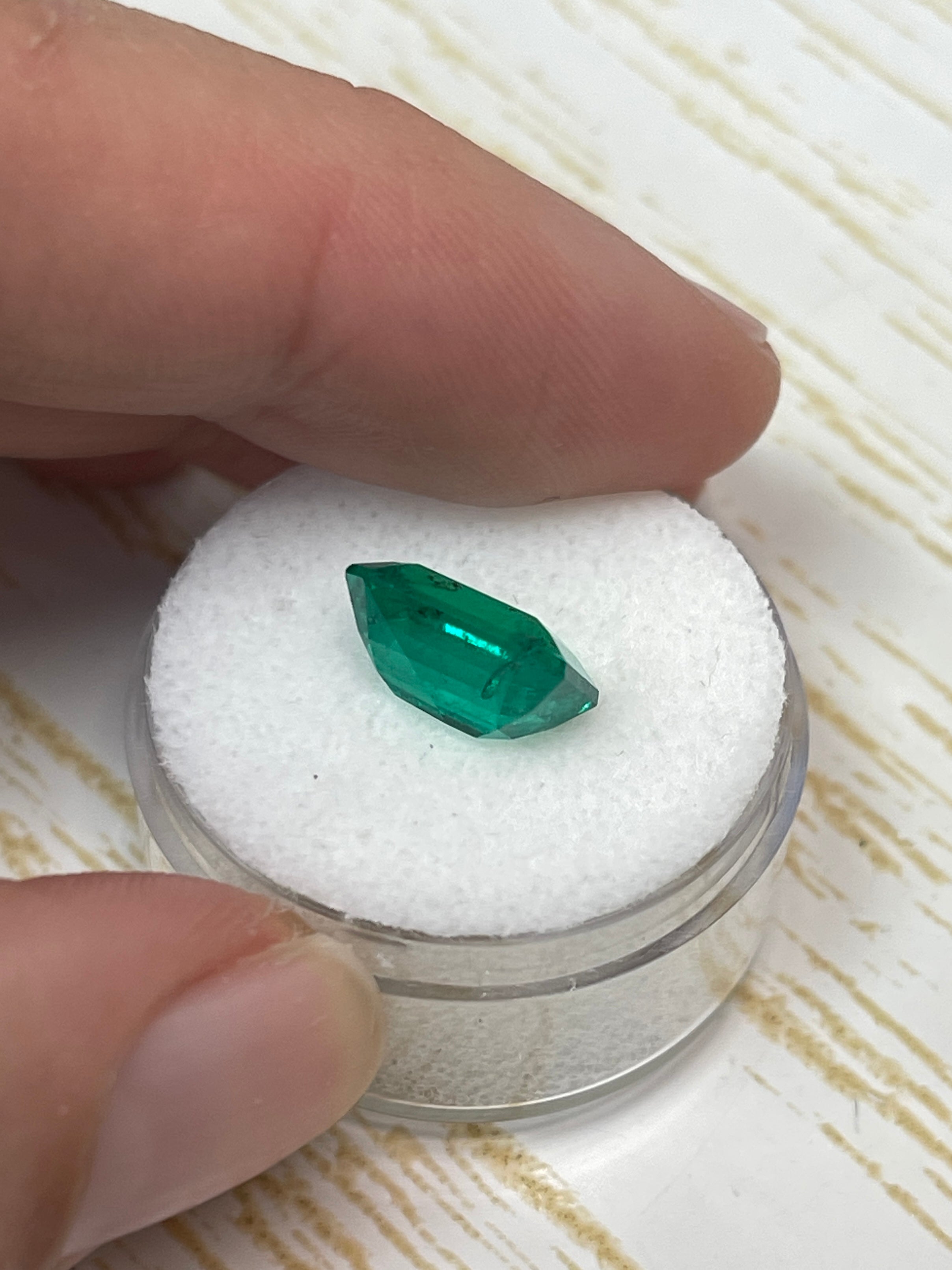 3.72 carat AAA+ green Colombian emerald cut loose gemstone with natural freckles, from JR Colombian Emeralds.