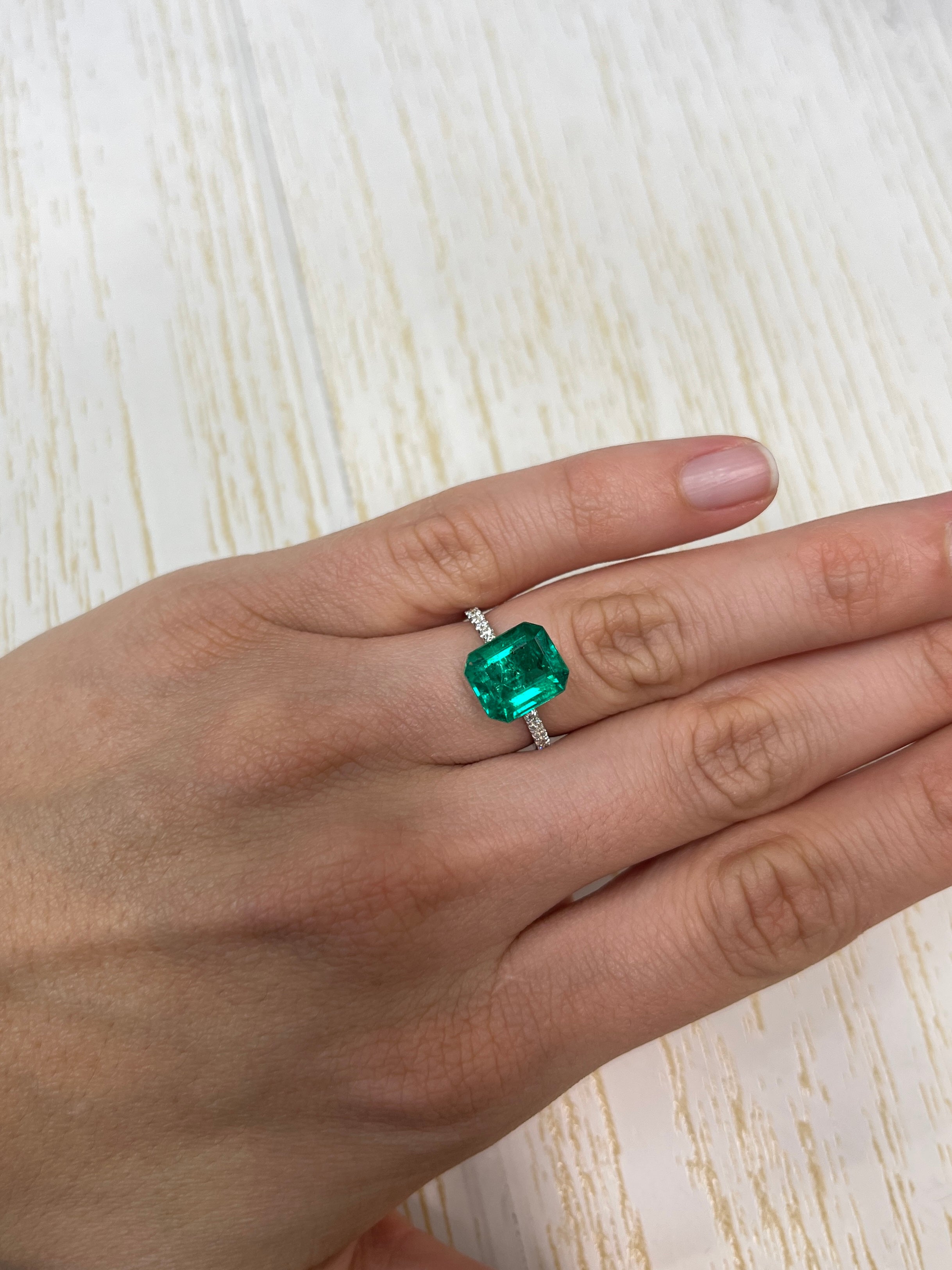 AAA+ 3.72 carat natural Colombian emerald loose stone, 11x9mm, green with freckles, emerald cut from JR Colombian Emeralds.