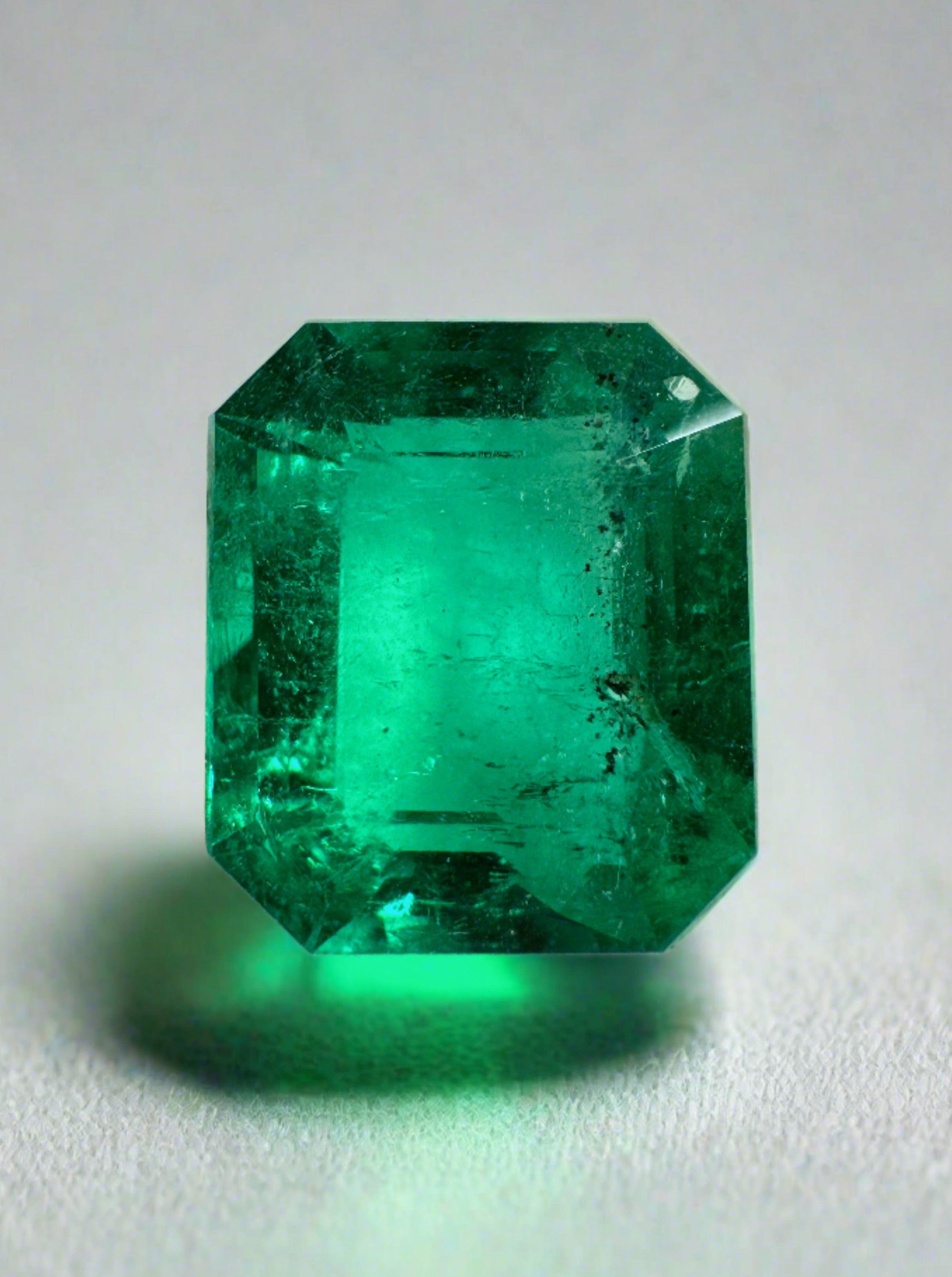 3.72 carat AAA+ green Colombian emerald cut loose gemstone with natural freckles, from JR Colombian Emeralds.