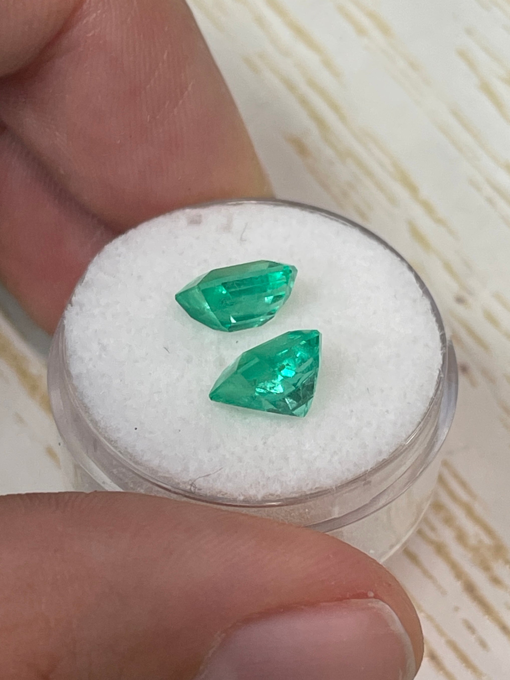 Three 3.73 carat total weight matching emerald cut Colombian emeralds in vibrant green, loose gemstones by JR Colombian Emeralds.