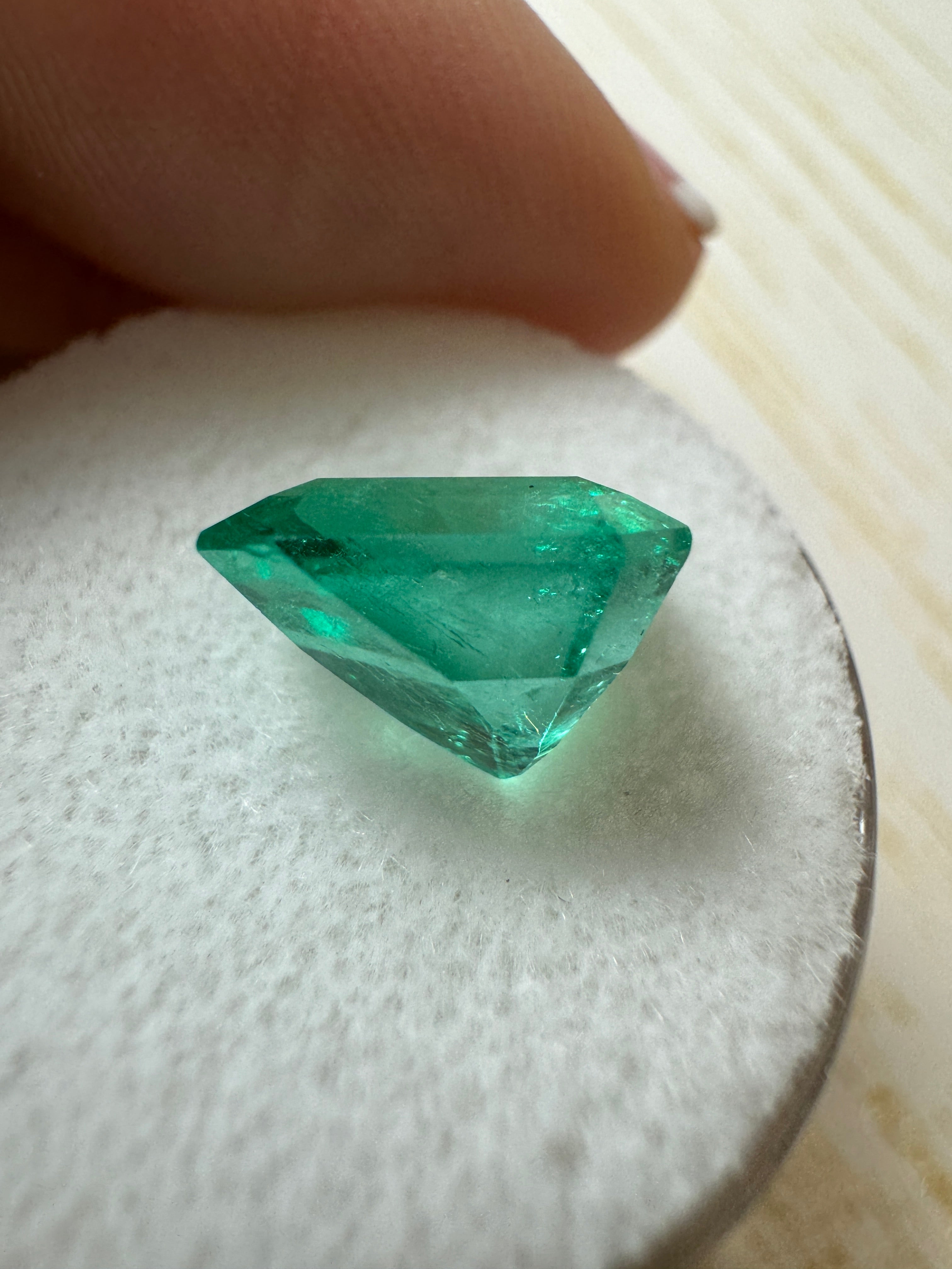 Glowing 3.80 carat natural Colombian emerald loose gemstone in 10x9 emerald cut, vibrant green color from JR Colombian Emeralds.