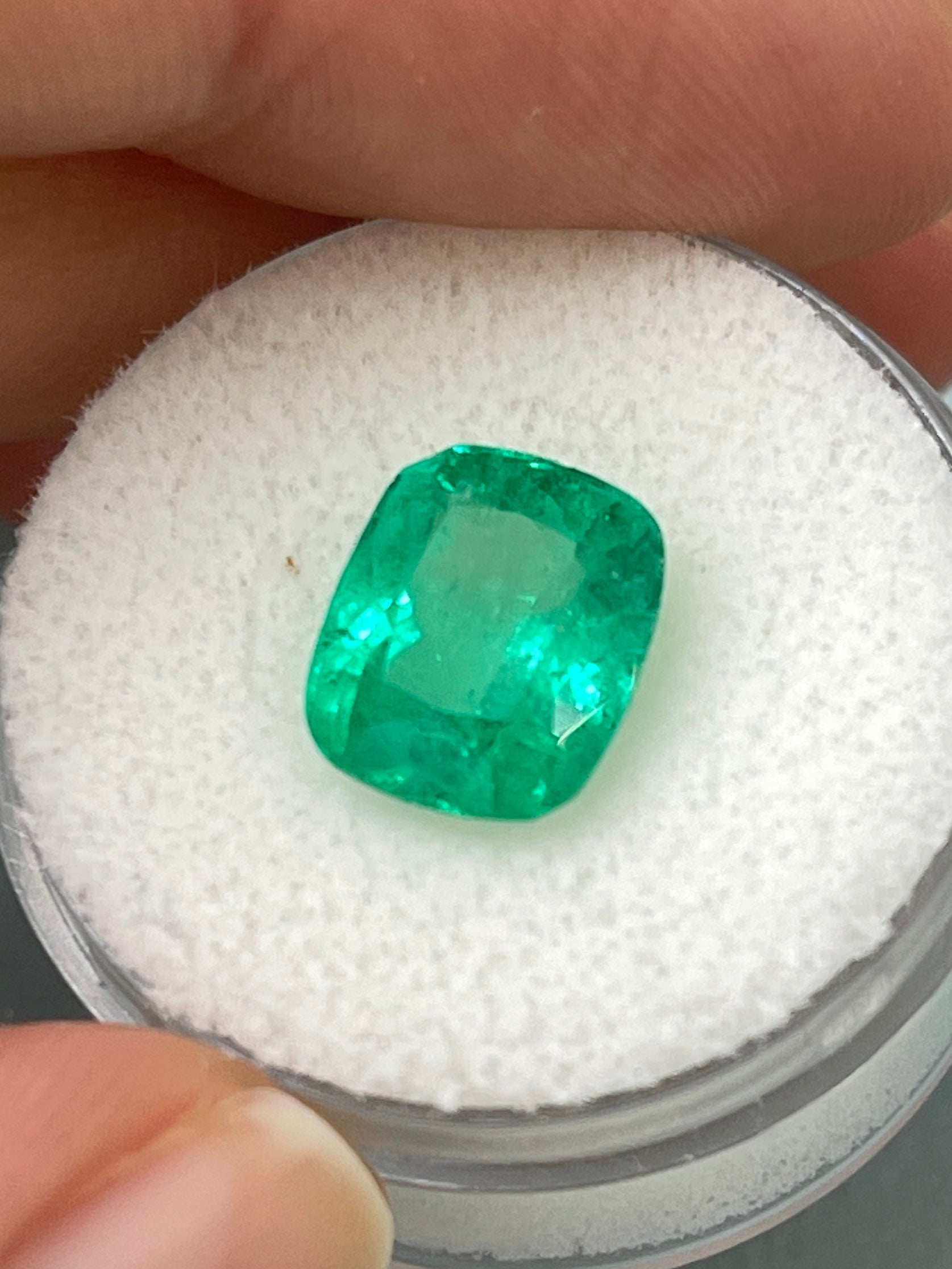 3.85 carat medium green Colombian emerald loose cushion cut gemstone from JR Colombian Emeralds. Natural and vibrant.