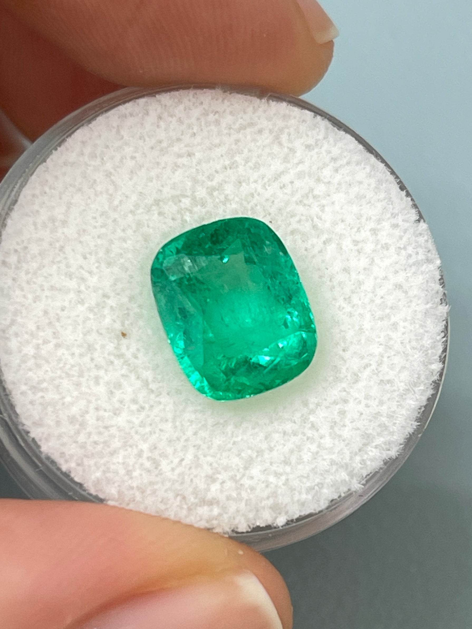 3.85 carat medium green Colombian emerald loose cushion cut gemstone from JR Colombian Emeralds, natural and vibrant in appearance.