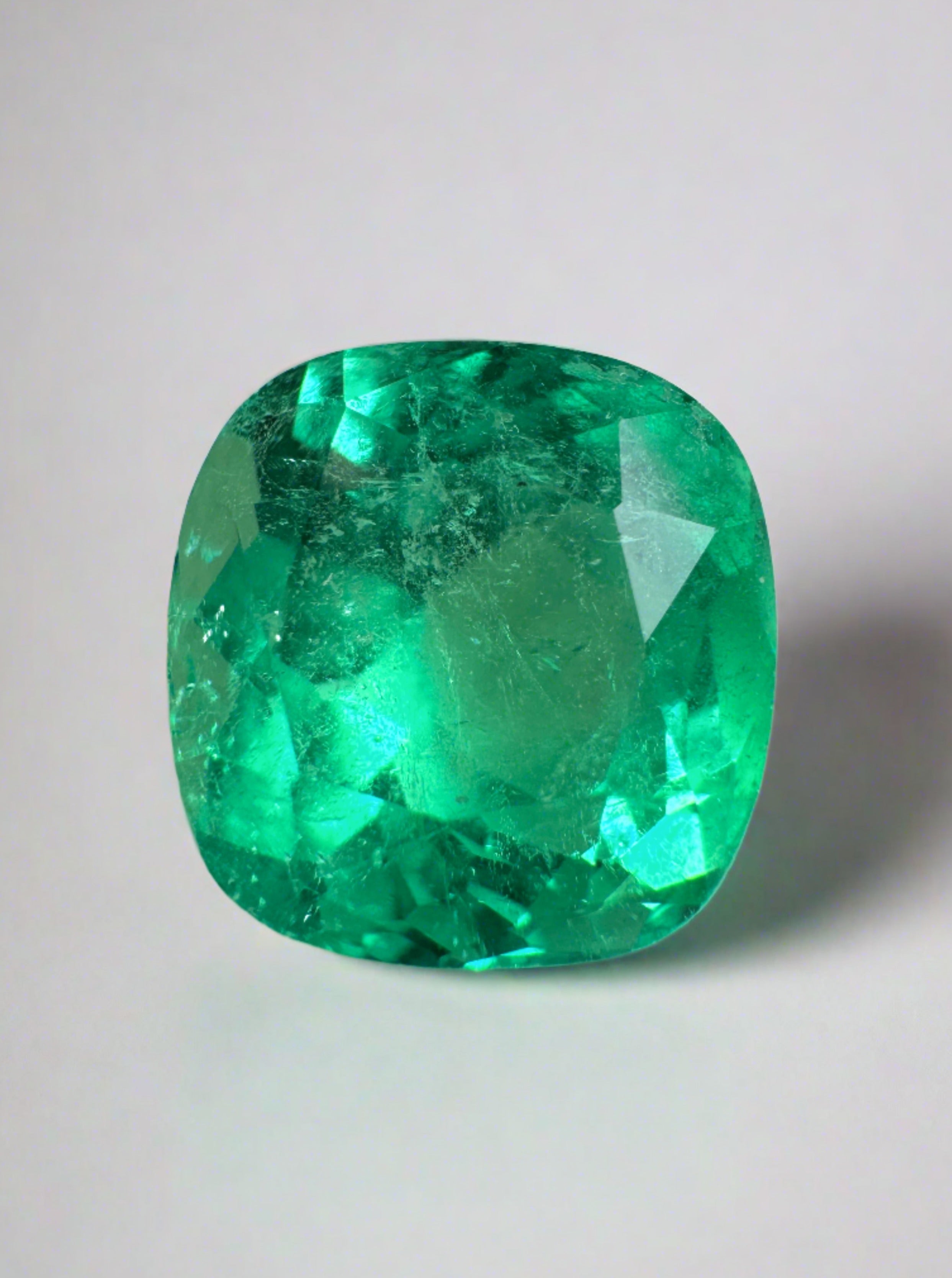 Bright yellowish-green 3.85 carat natural Colombian emerald in cushion cut, showcasing vibrant color and clarity.