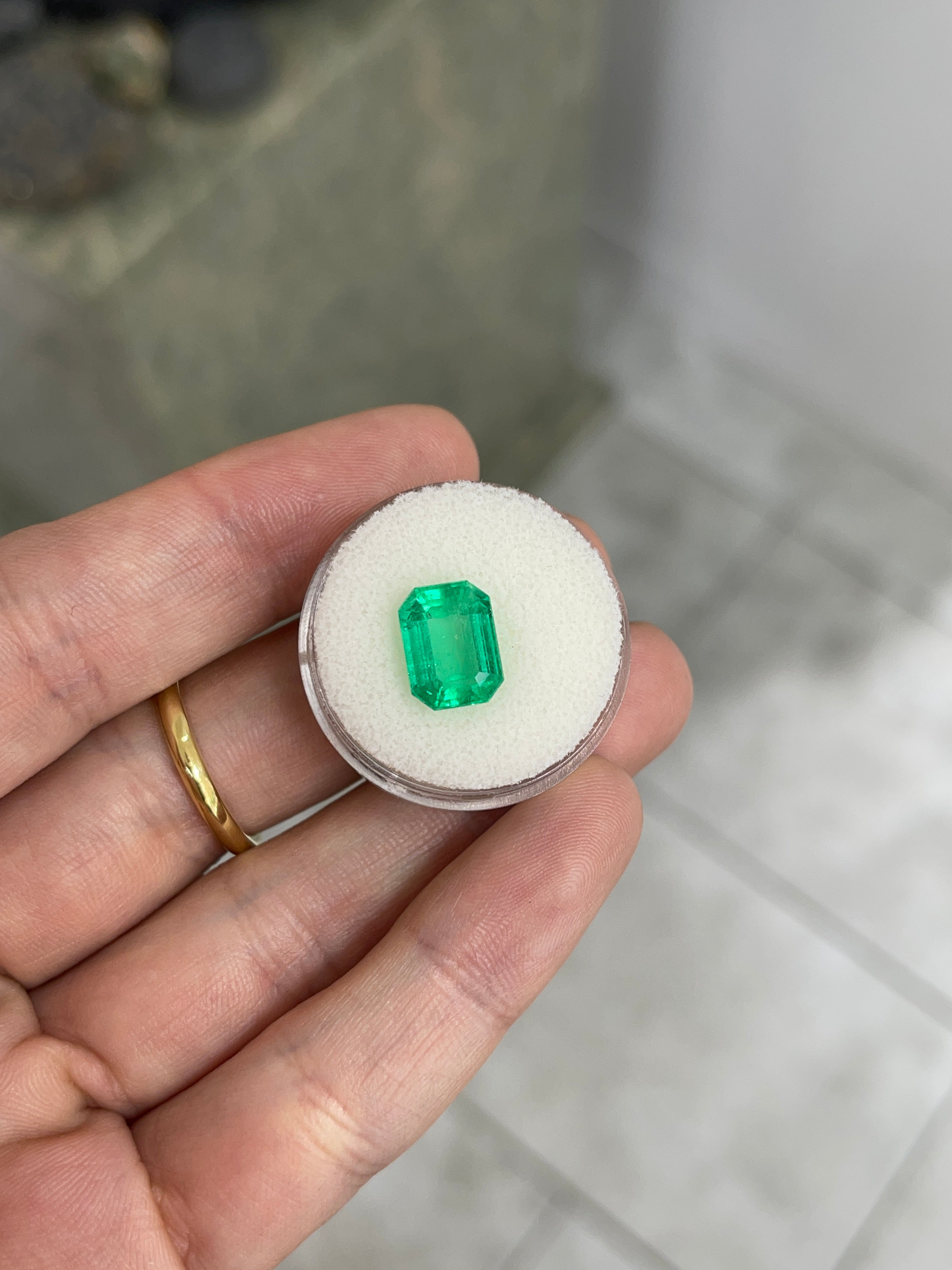 Natural 3.88 Carat green Colombian emerald loose gemstone, emerald cut, glowing and vibrant, from JR Colombian Emeralds.