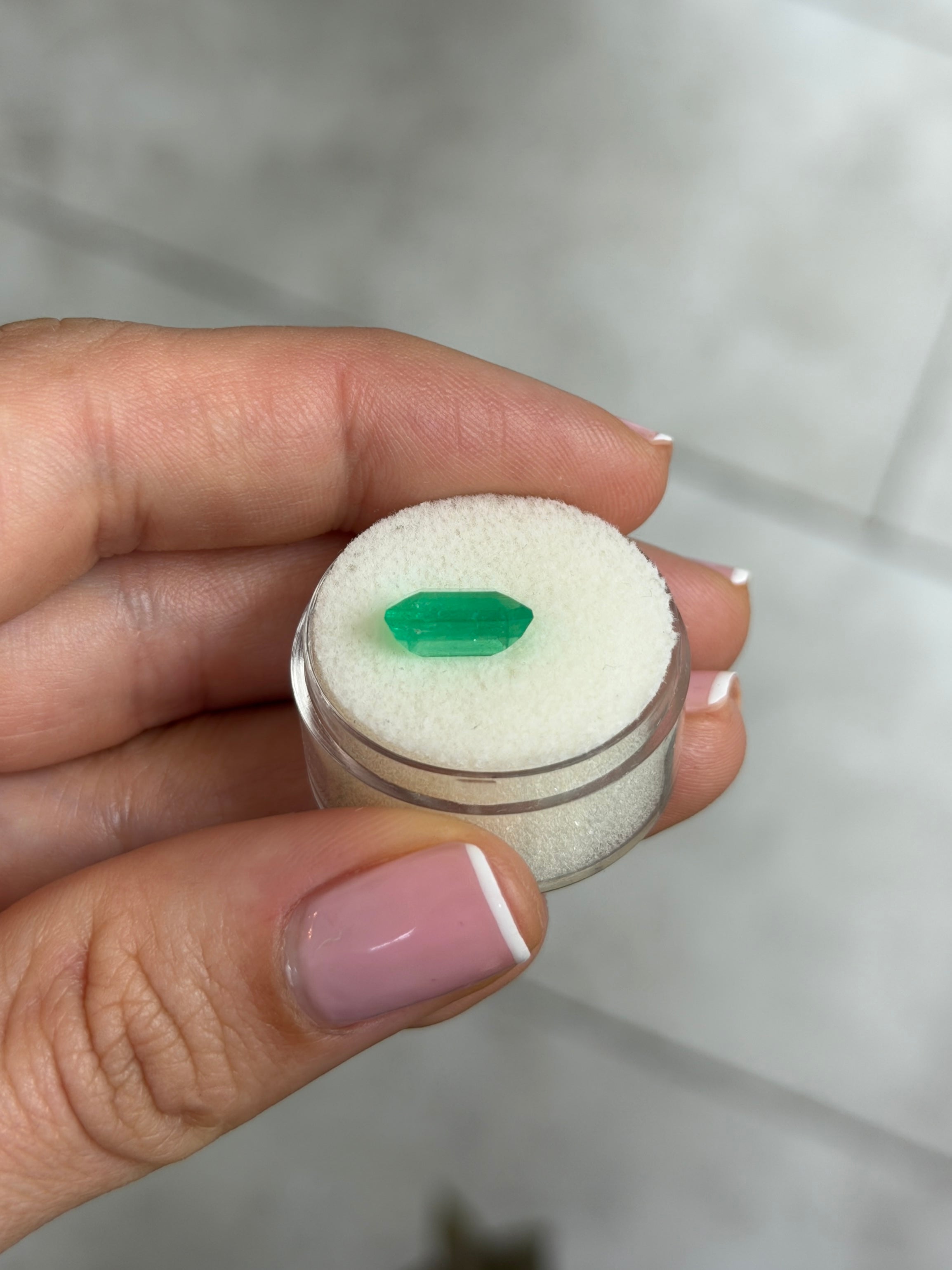 3.94 Carat yellowish green natural Colombian emerald in Asscher cut, loose gemstone with vivid color and clarity.