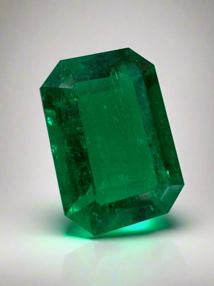 Vivid green 3.95 carat Colombian emerald cut loose emerald with GIA certification, showcasing a vibrant emerald gemstone.