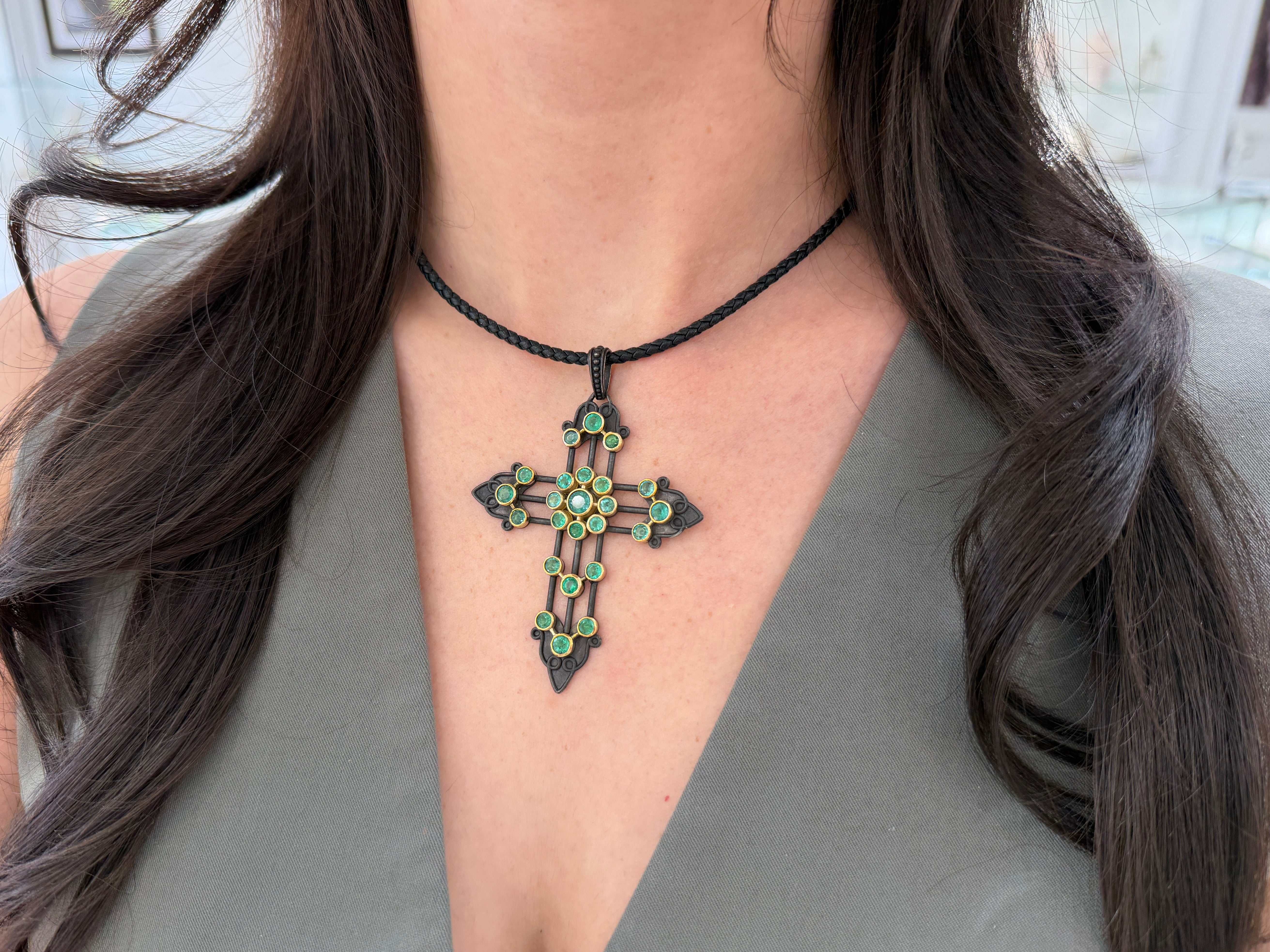 Gothic emerald crucifix pendant with 3.95tcw gemstones in 14K gold and blackened silver, featuring intricate design details.