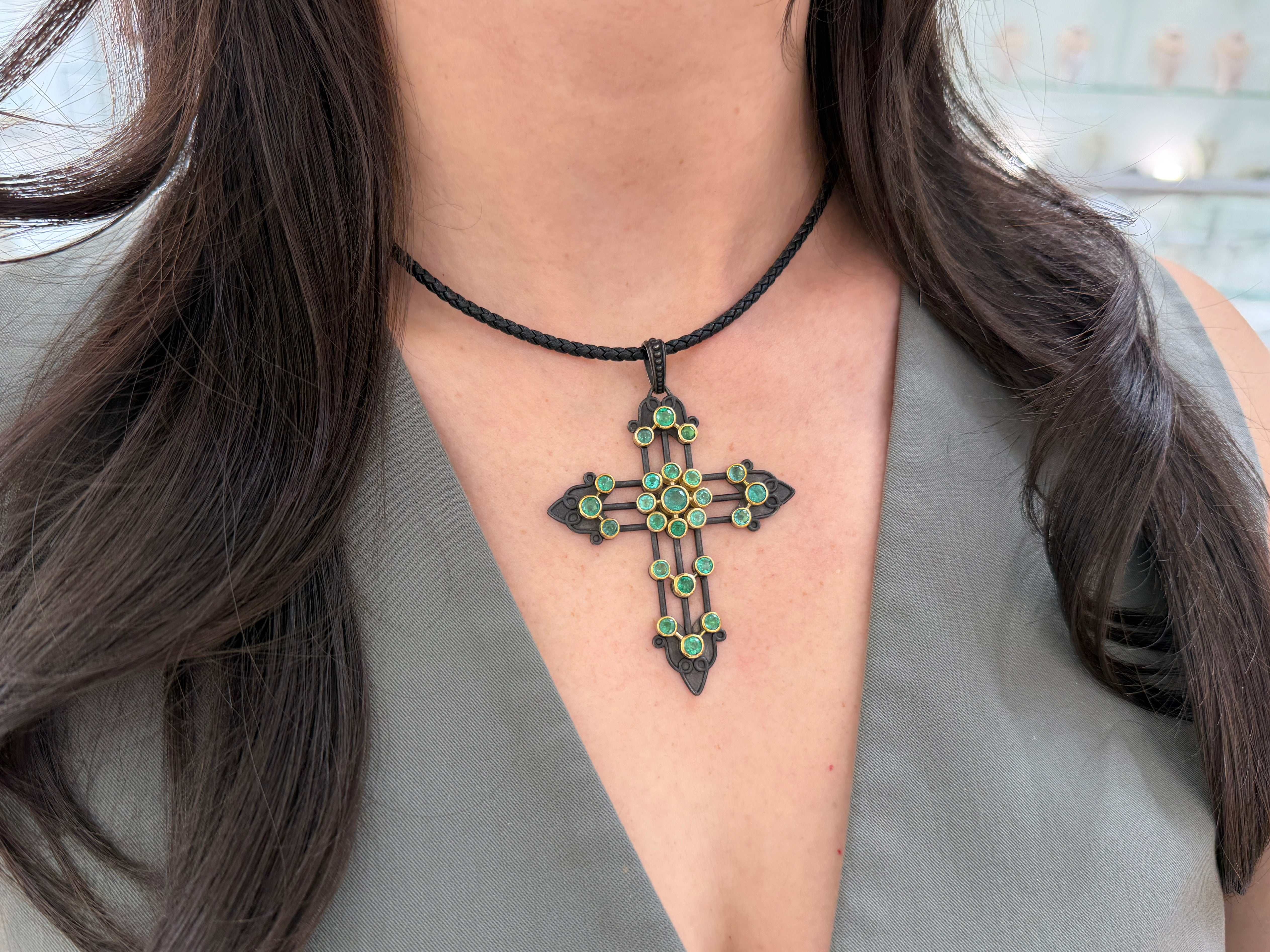 Gothic emerald crucifix pendant with 3.95tcw Colombian emeralds in 14K gold and blackened silver, detailed jewelry design.