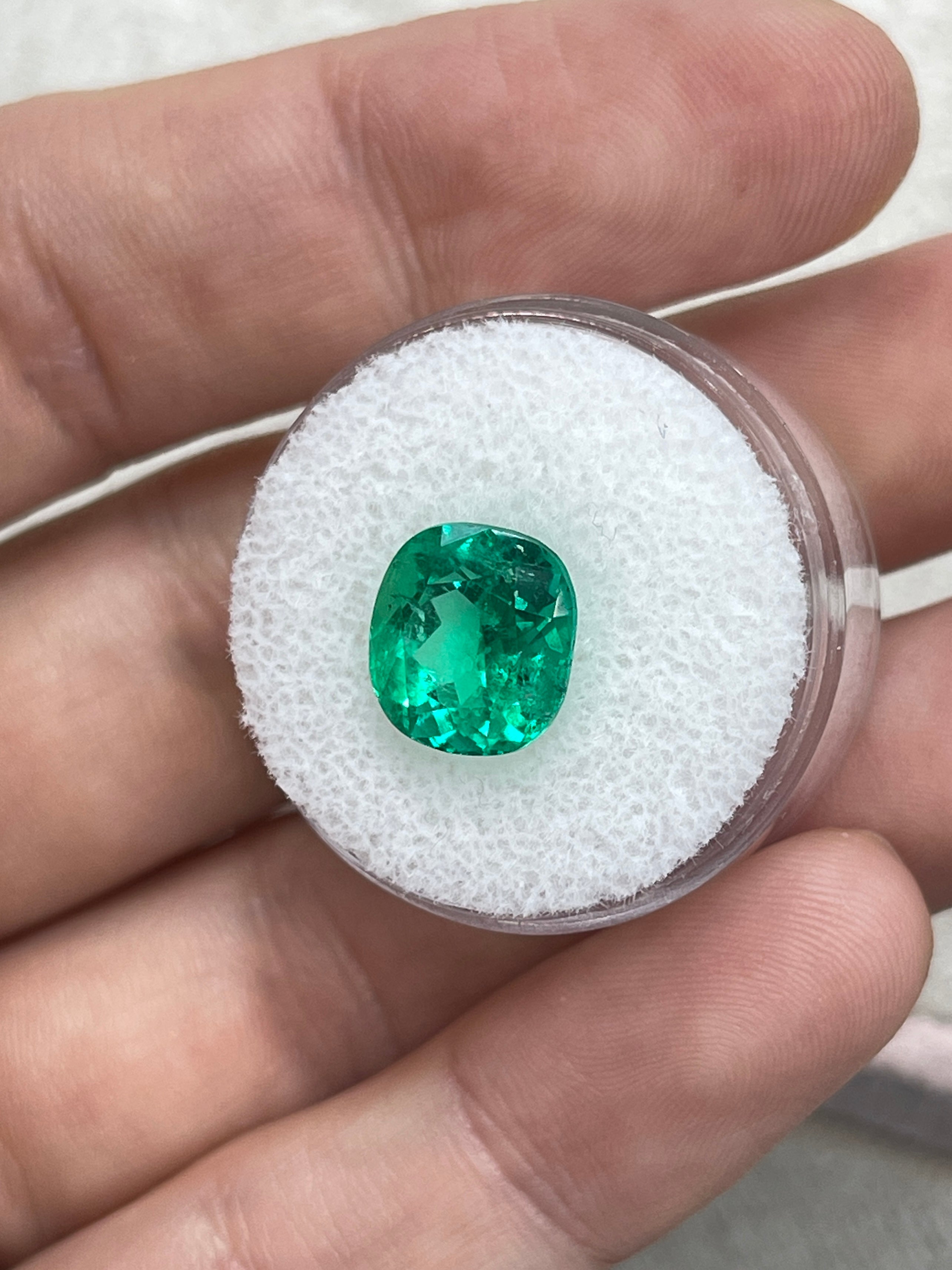 4.96 carat freckled vivid bluish-green cushion cut loose emerald by JR Colombian Emeralds. Natural gemstone with unique inclusions.