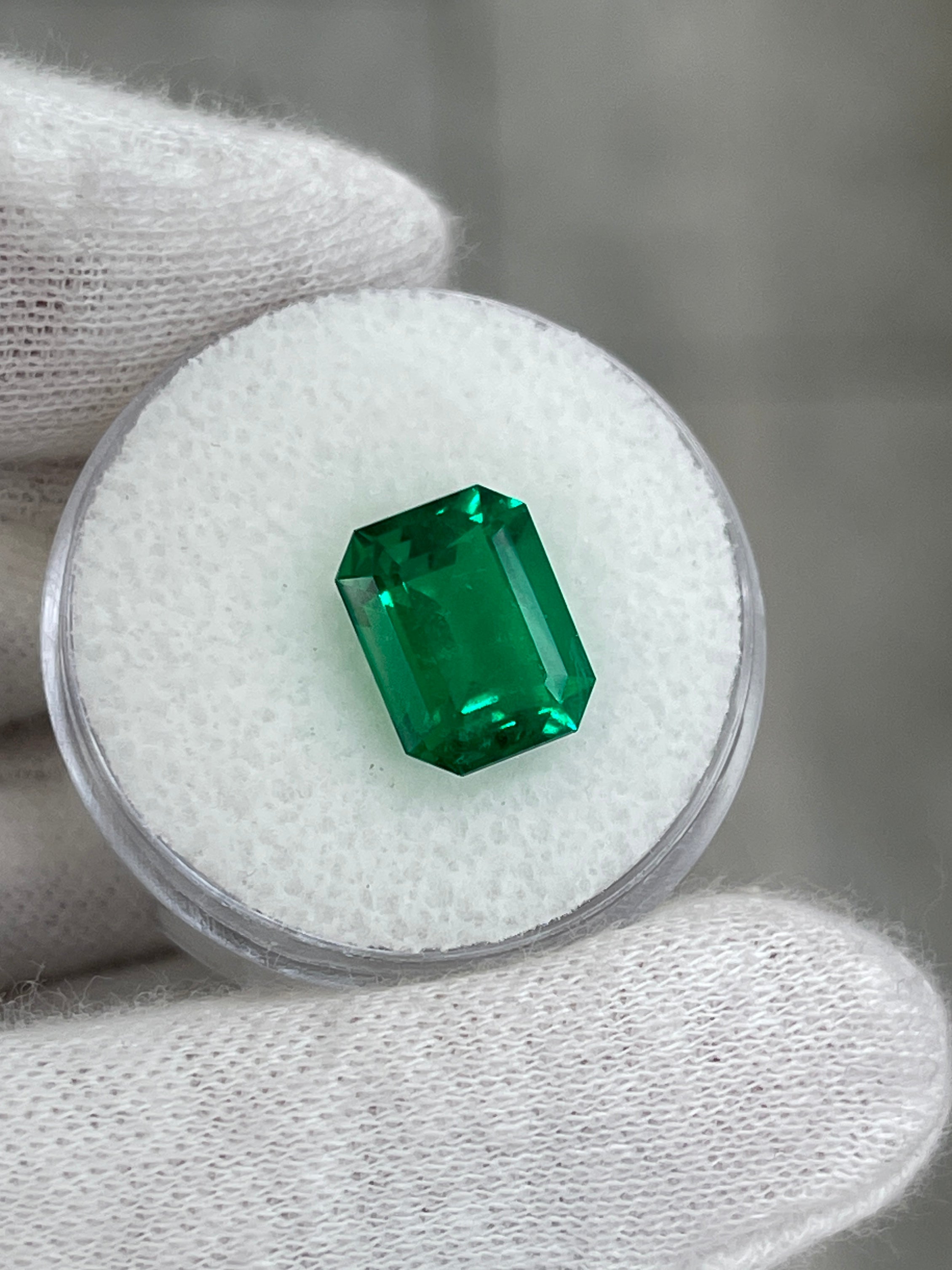 4.03 Carat AAA Minor Oil Colombian Emerald loose gemstone in vivid Muzo green, 11x9 mm emerald cut, from JR Colombian Emeralds.