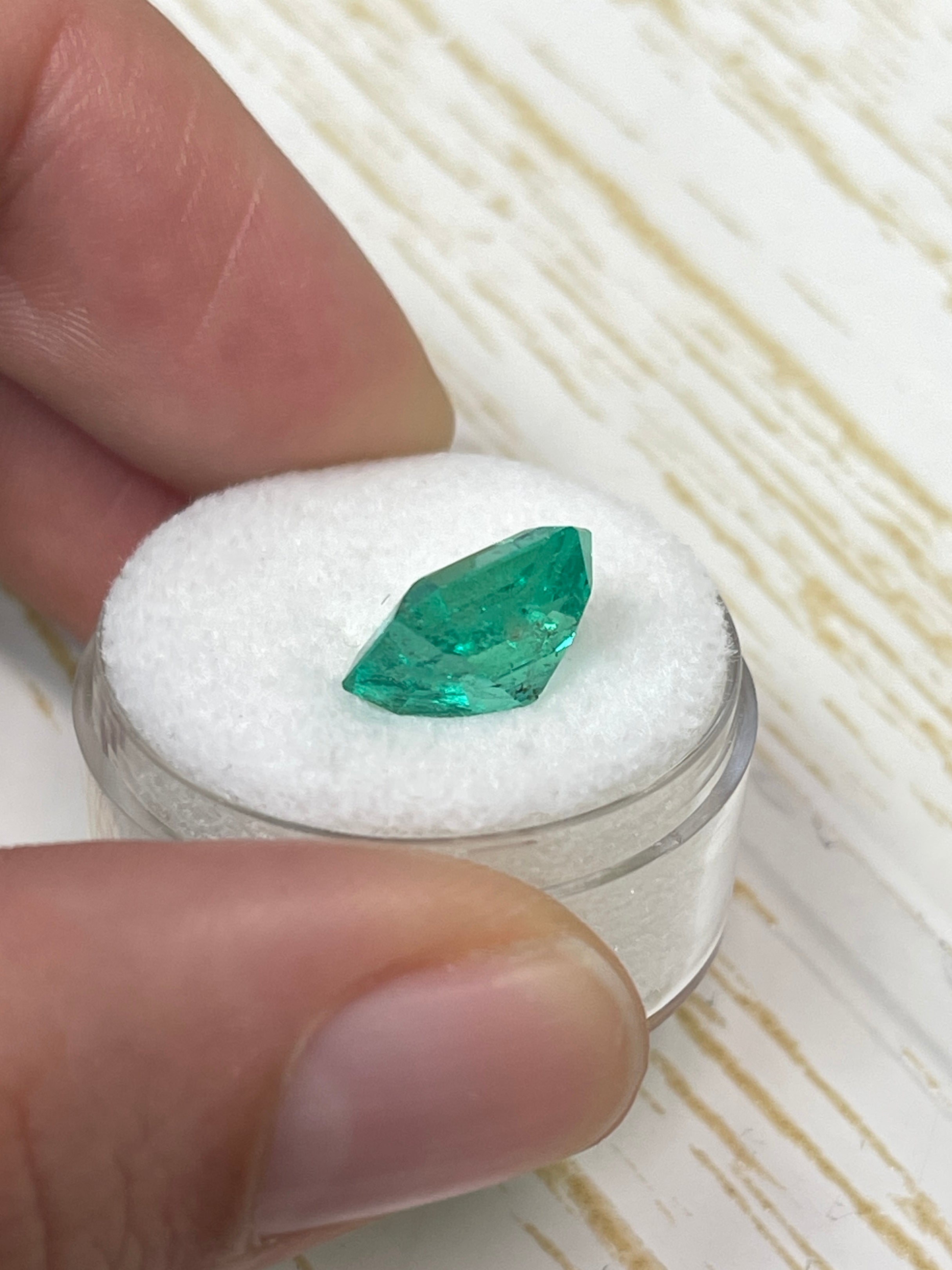 Vibrant 4.33 carat Colombian emerald loose gemstone in 10x10mm Asscher cut, showcased by JR Colombian Emeralds.