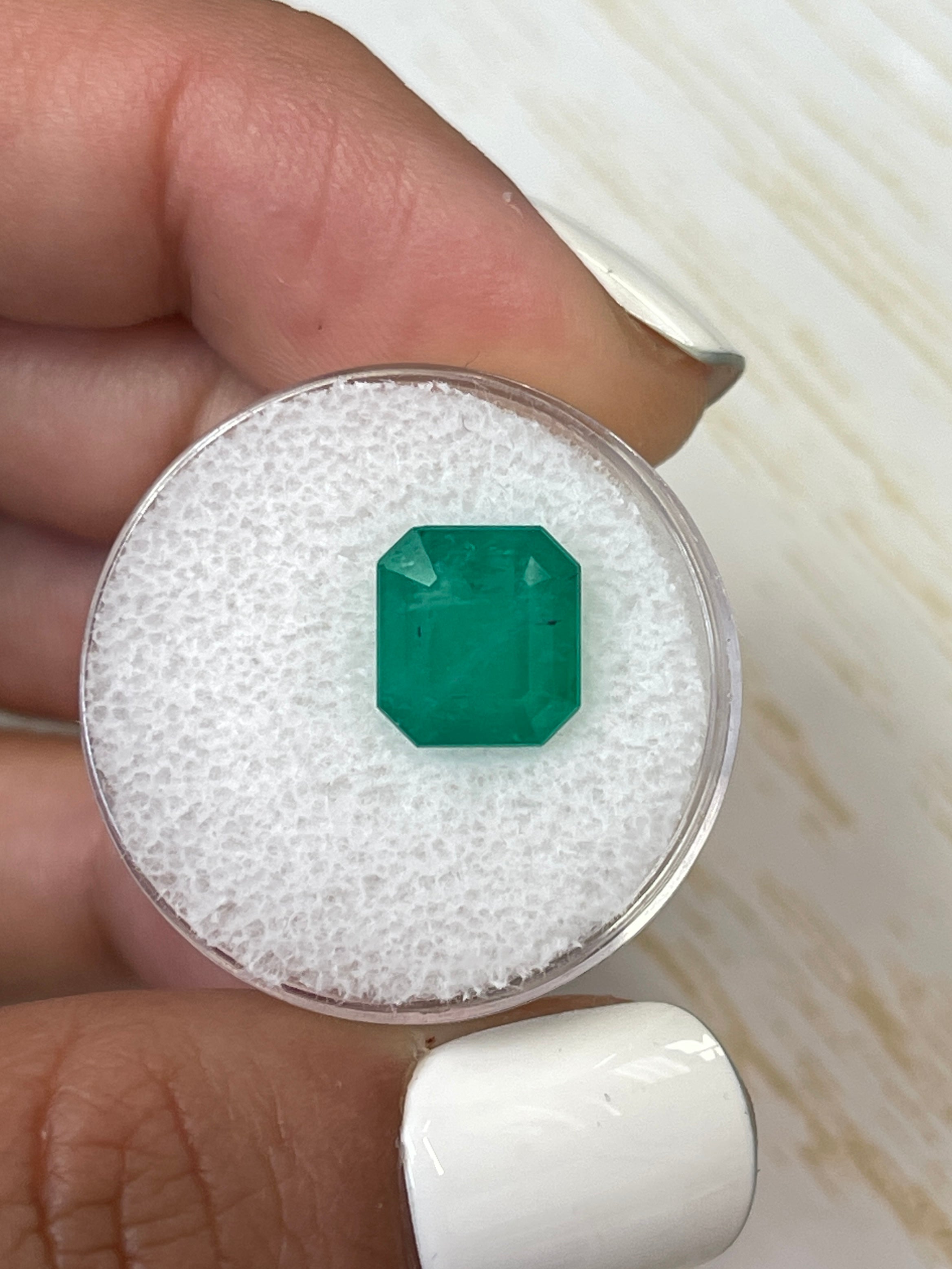 Forest green Colombian emerald Asscher cut, 4.34 carats, from JR Colombian Emeralds, showcasing vibrant green color and precise cut.