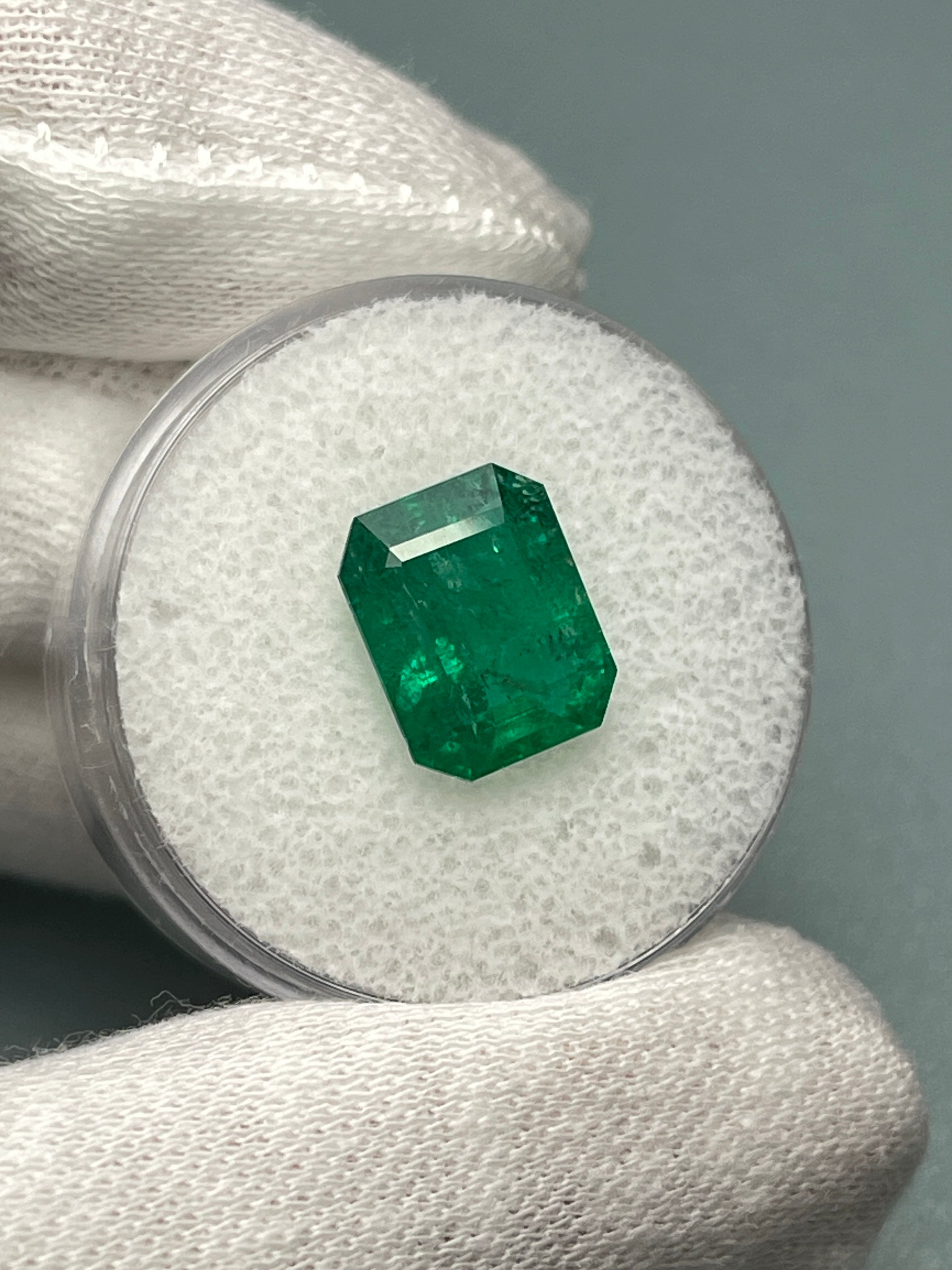 Deep green 4.36 carat natural Zambian emerald cut loose gemstone from JR Colombian Emeralds, showcasing its rich color and clarity.