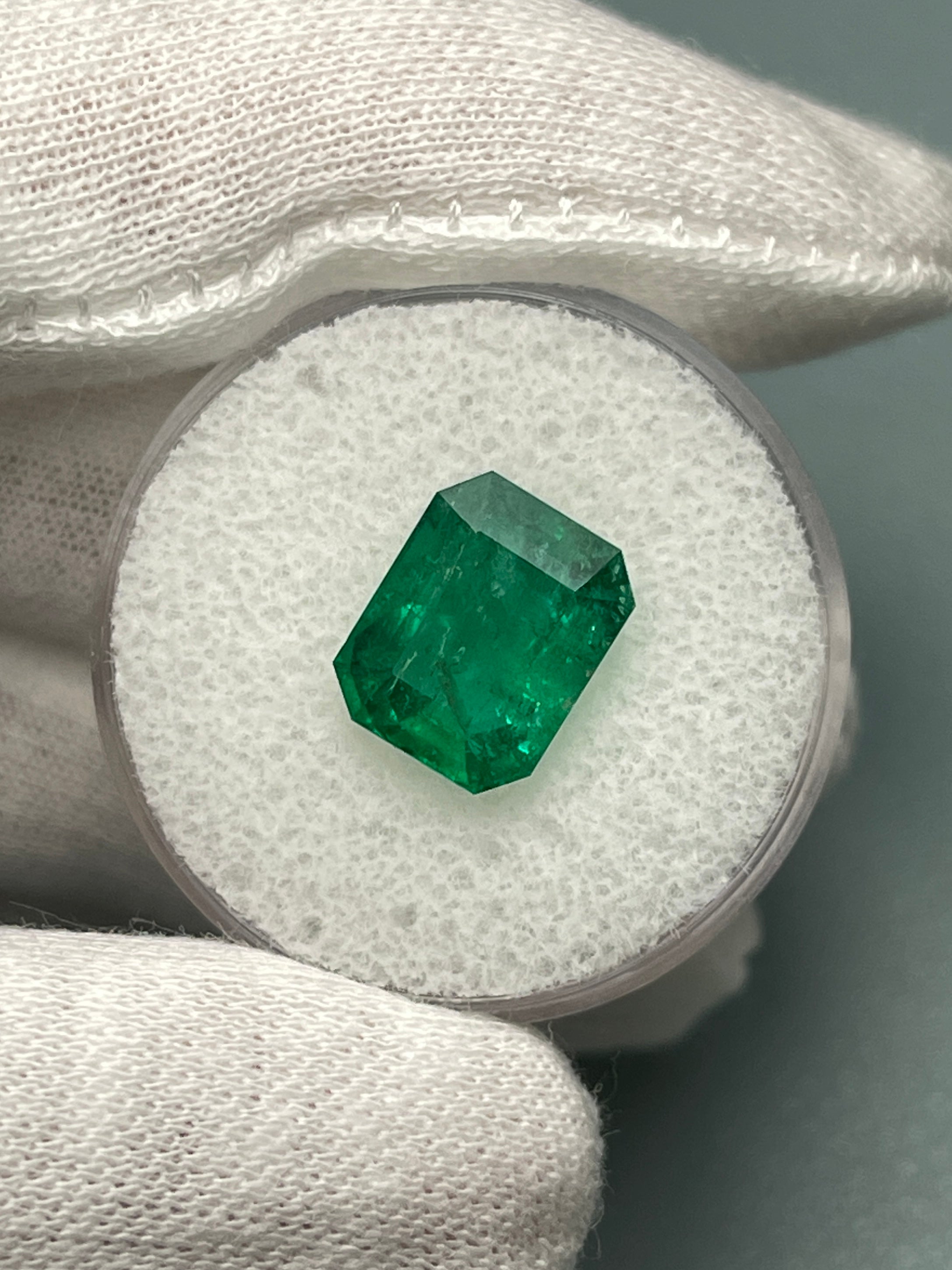 Deep green 4.36 carat natural Zambian emerald cut loose gemstone by JR Colombian Emeralds, showing a vibrant, polished stone.