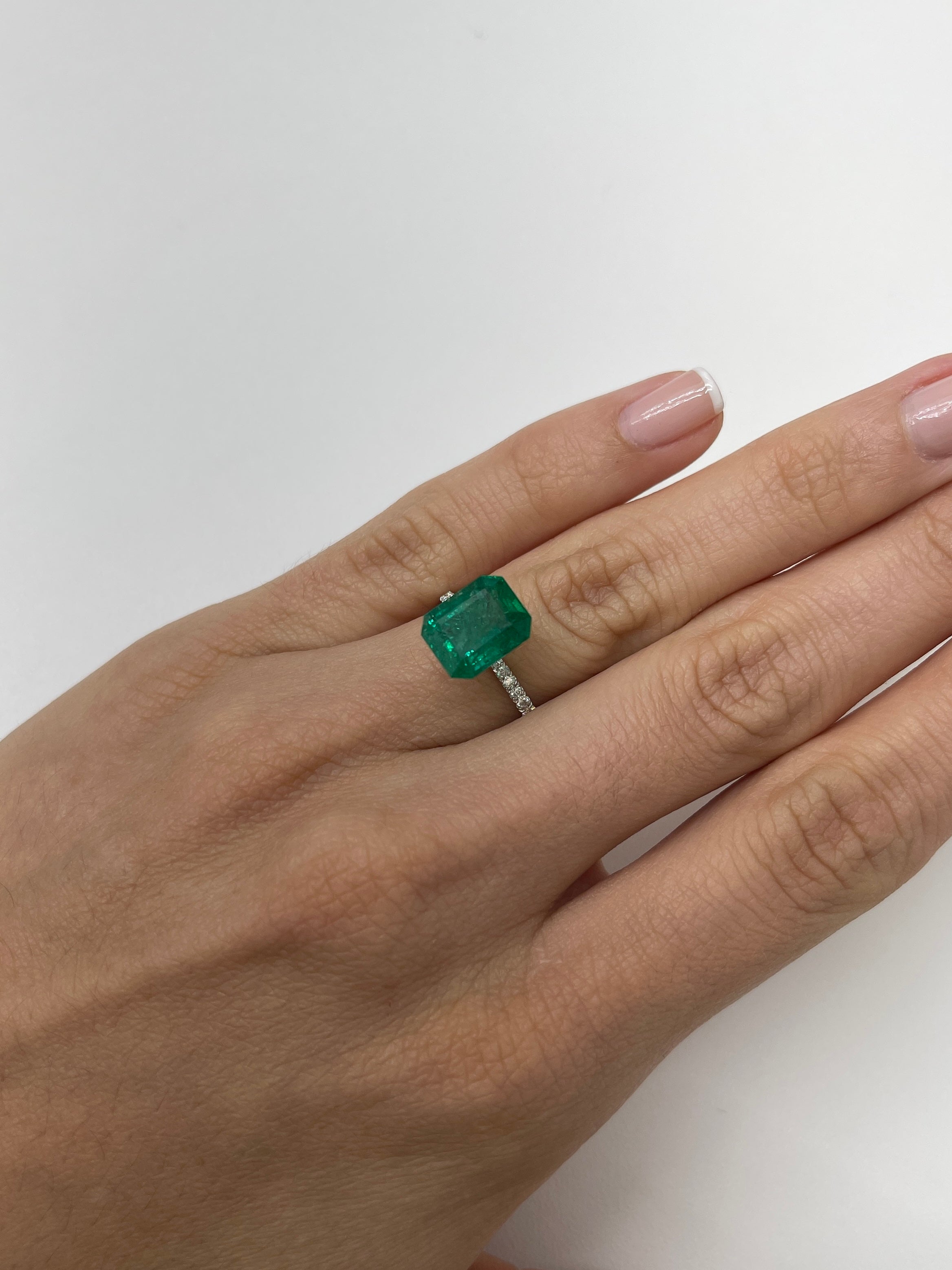 Deep green 4.36-carat Zambian emerald cut loose gemstone from JR Colombian Emeralds, showcasing vibrant color and clarity.