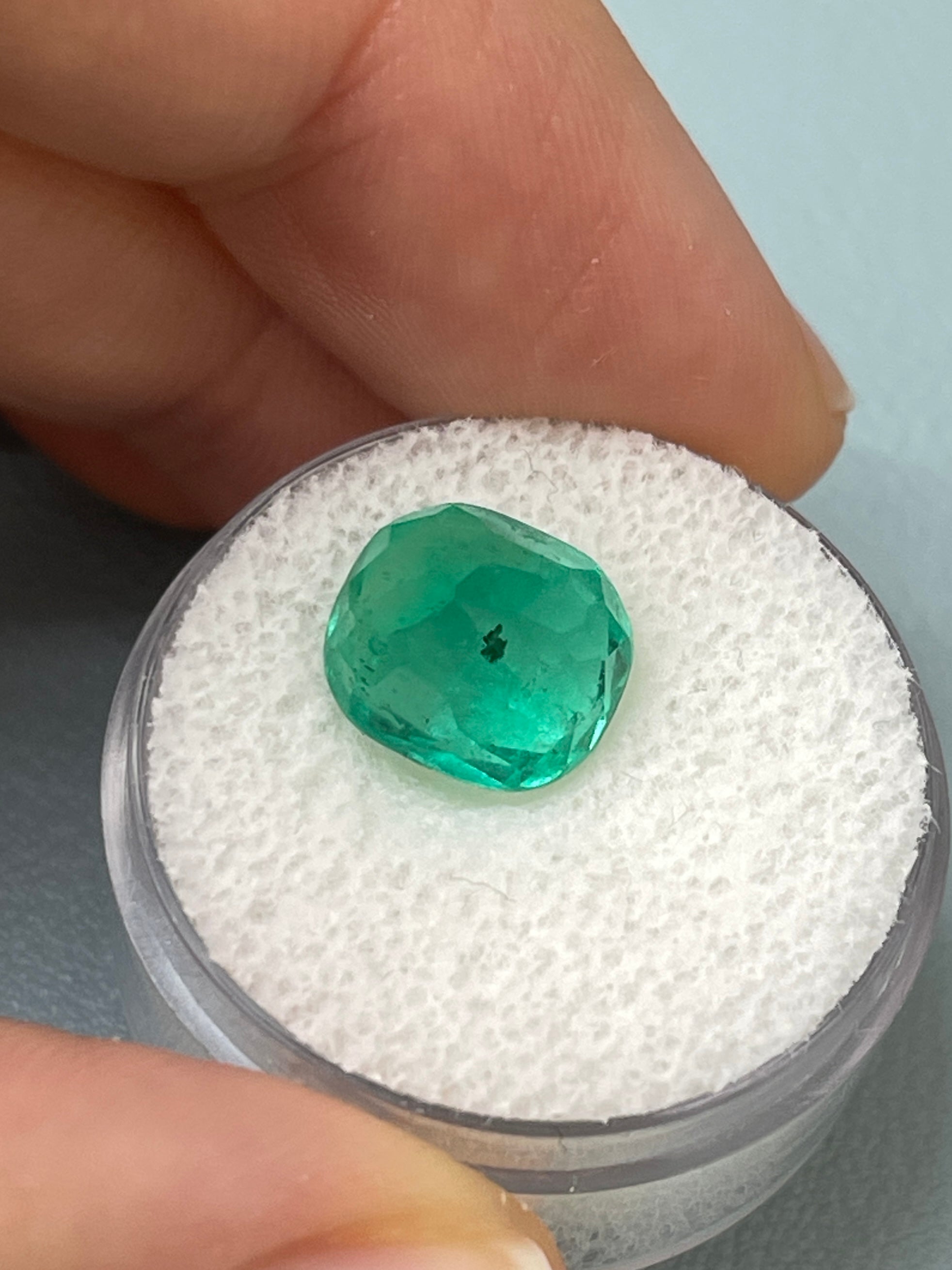 Deep green 4.37 carat Colombian emerald, cushion cut, natural loose gemstone with freckles, from JR Colombian Emeralds.