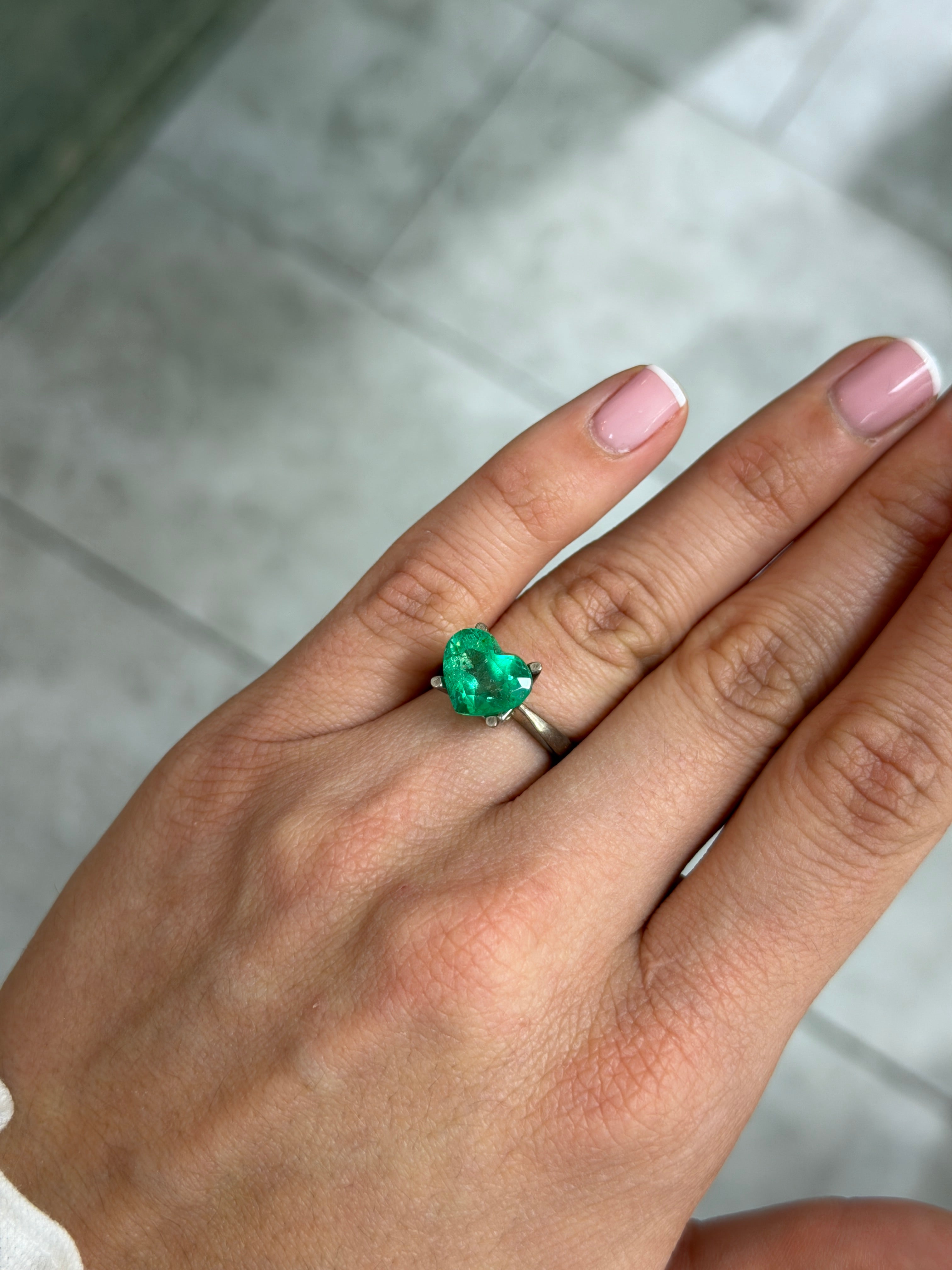 Natural glowing green 4.40 carat Colombian emerald heart cut loose gemstone from JR Colombian Emeralds.