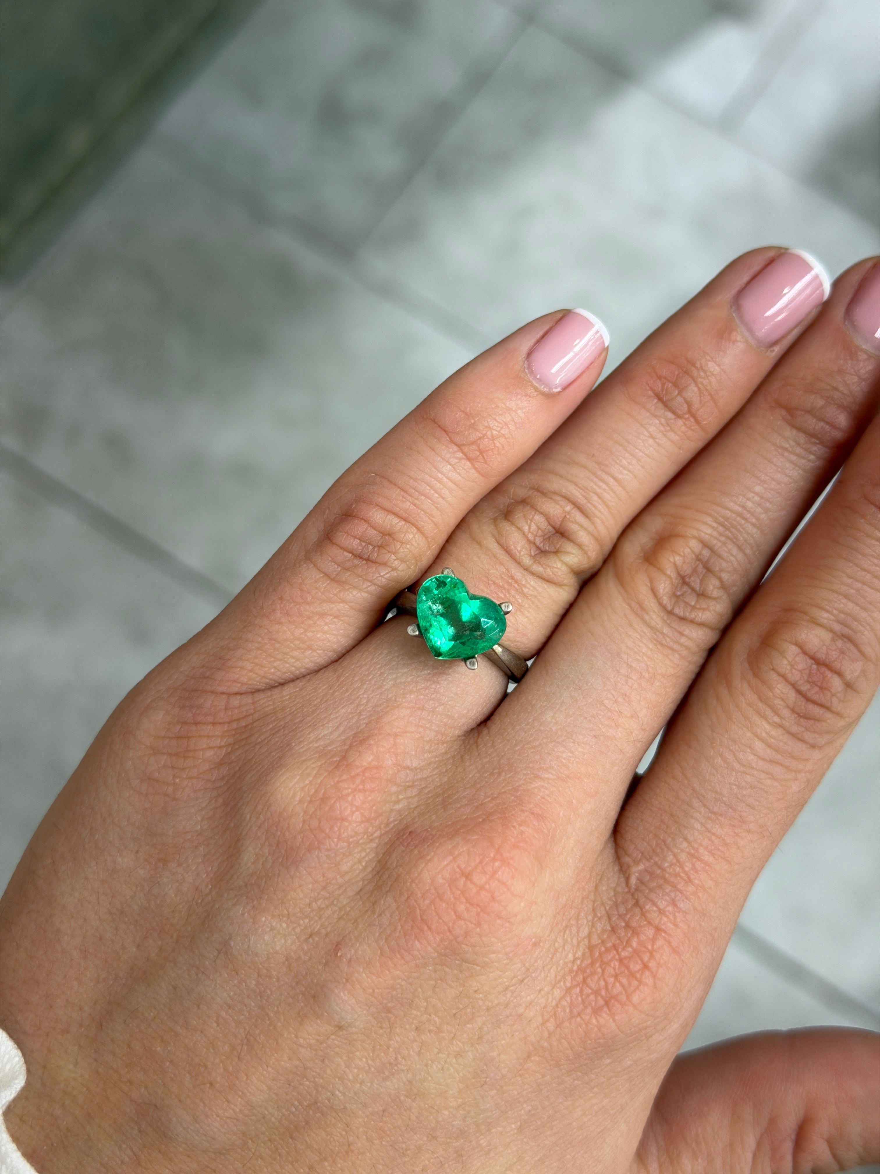 Natural loose Colombian emerald, 4.40 carats, heart cut, glowing green, from JR Colombian Emeralds.