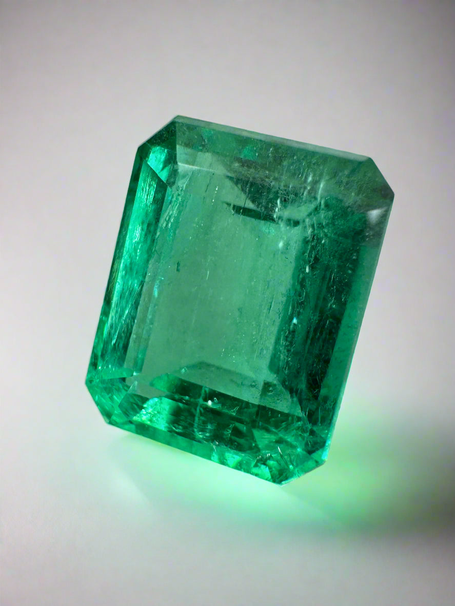 4.43 carat Jyotish green Colombian emerald loose gemstone in emerald cut, from JR Colombian Emeralds, showing rich natural color and clarity.