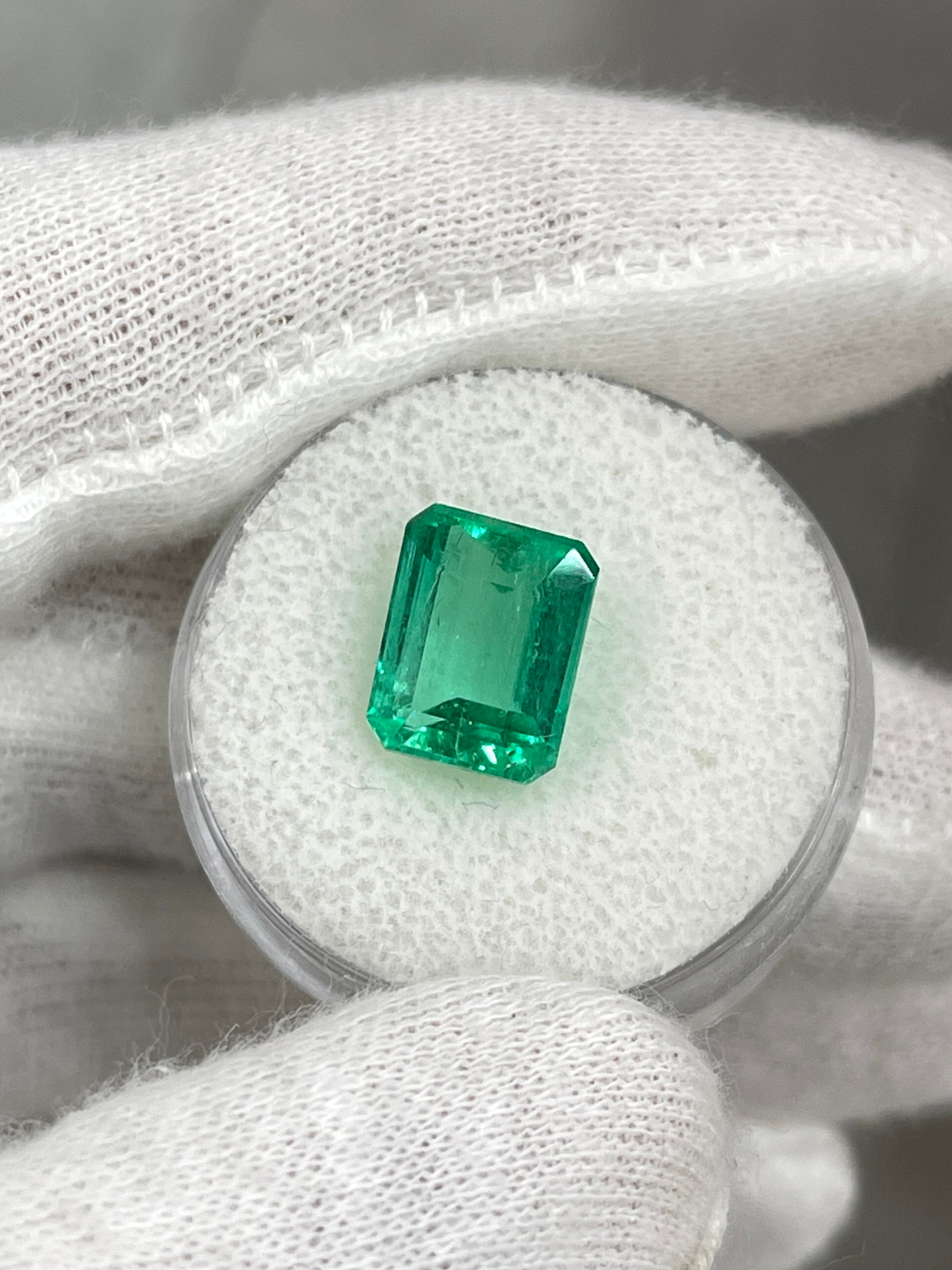 4.43 carat Jyotish green Colombian emerald loose gemstone in emerald cut, showcasing vibrant natural green color and clarity.