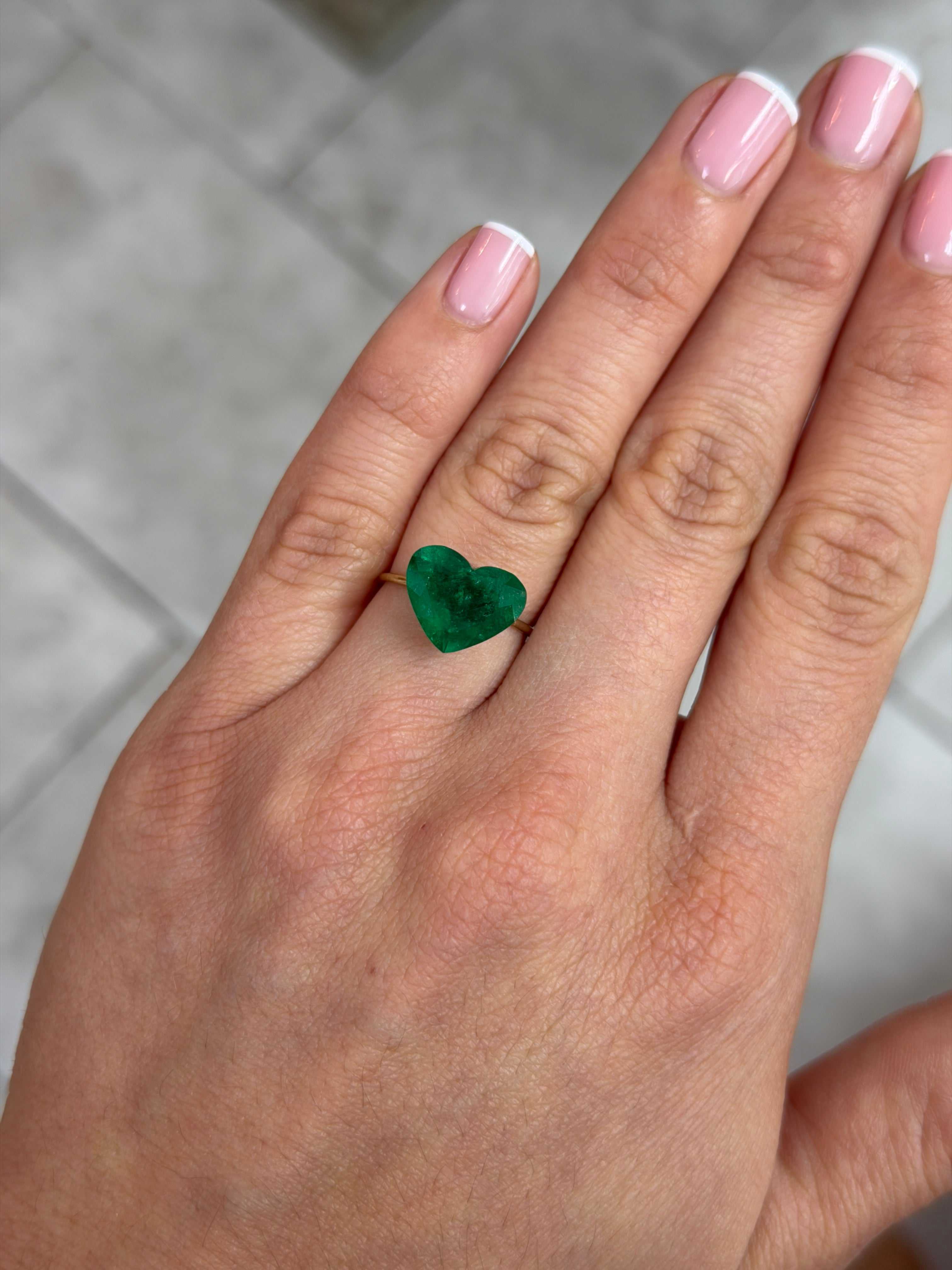4.46 carat AAA+ intense green natural Colombian emerald heart-shaped loose gemstone by JR Colombian Emeralds.