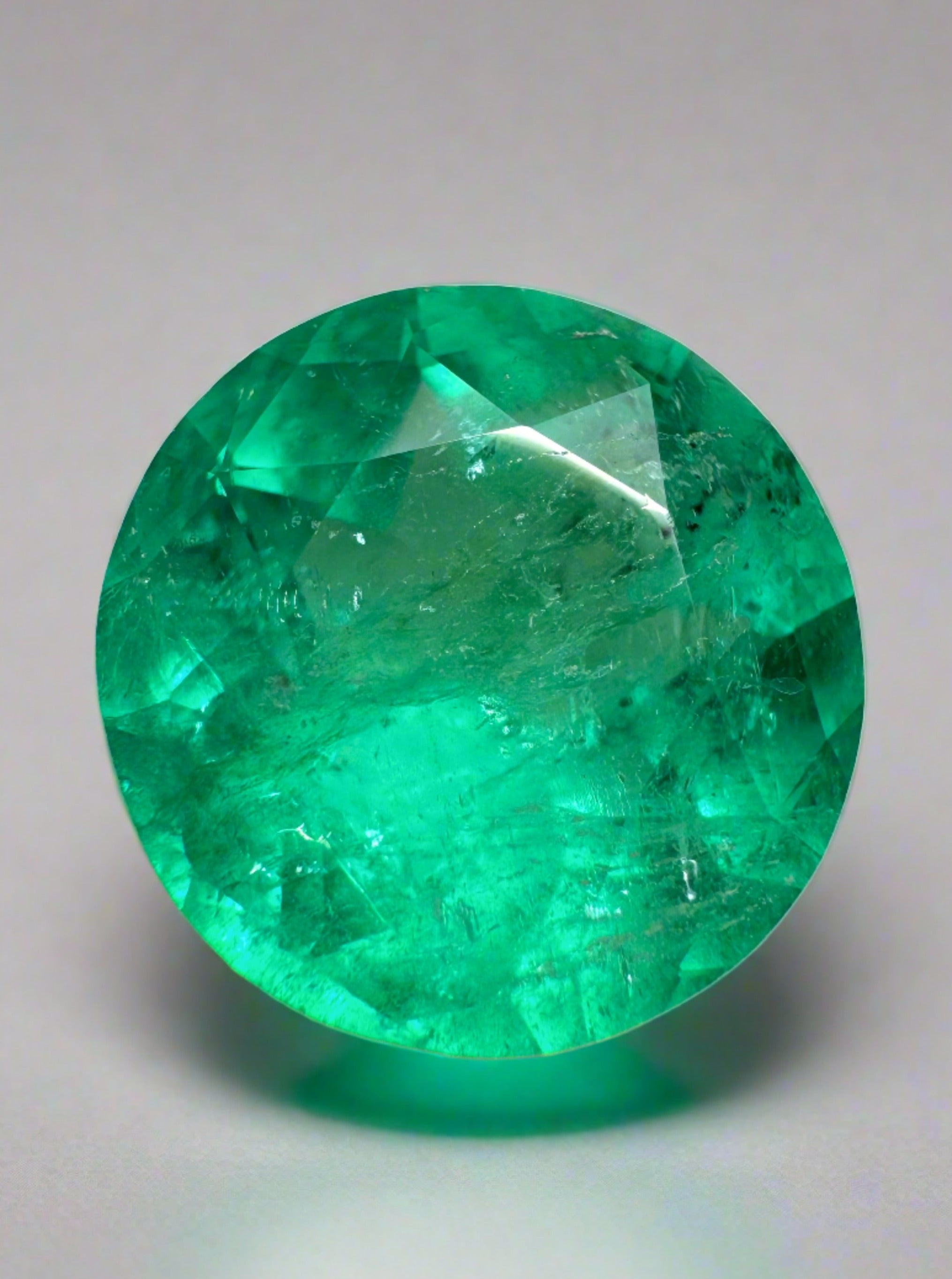 4.50 carat bluish green natural round Colombian emerald gemstone from JR Colombian Emeralds, loose and uncut.