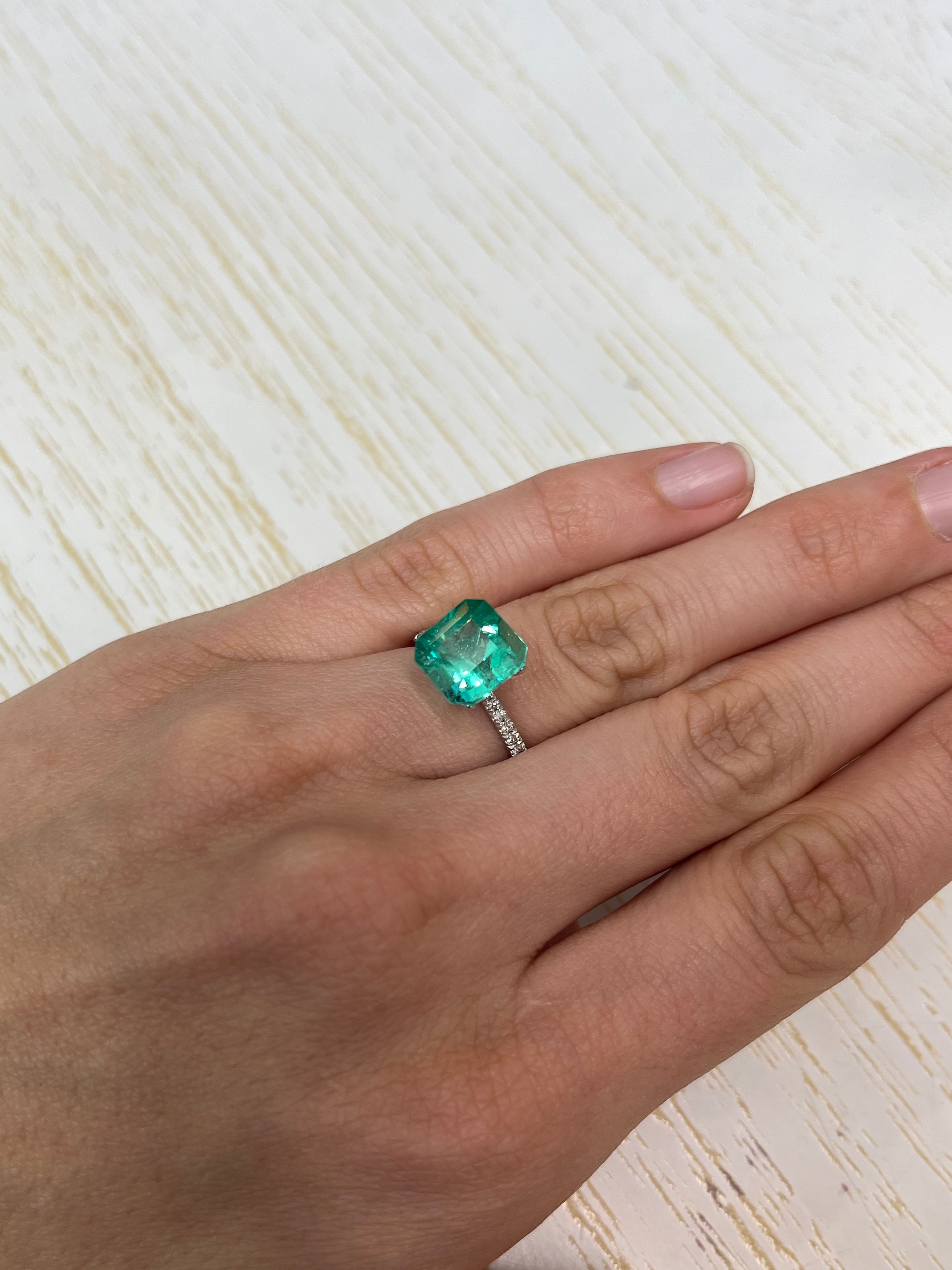 Vibrant 4.53 carat loose Colombian emerald Asscher cut gemstone from JR Colombian Emeralds, showcasing deep green color and clarity.
