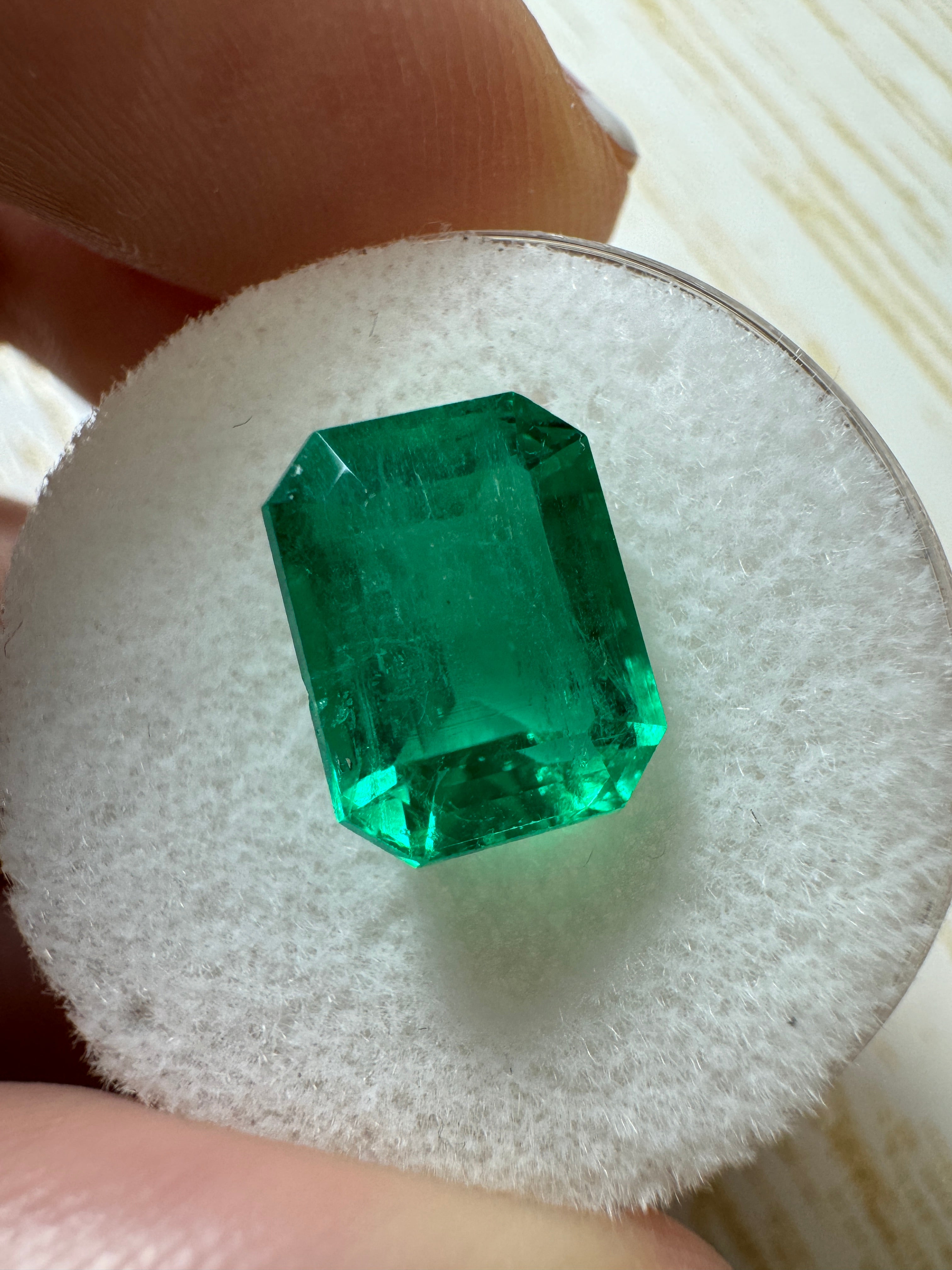 Vivid 4.53 Carat Muzo Green Colombian Emerald loose gemstone in emerald cut, natural and vibrant from JR Colombian Emeralds.