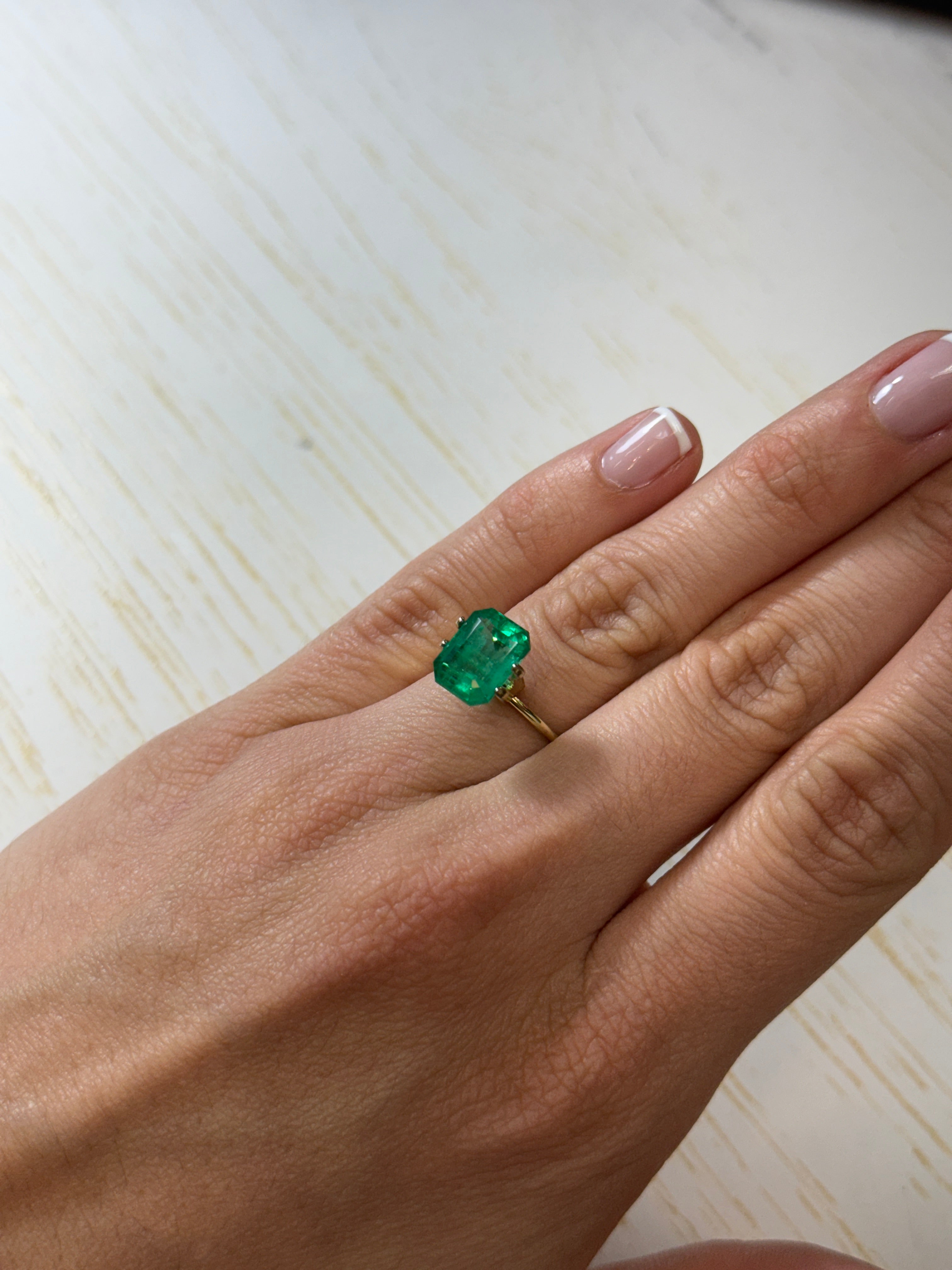 Vivid 4.53 Carat Muzo green Colombian emerald loose gemstone in emerald cut, from JR Colombian Emeralds.