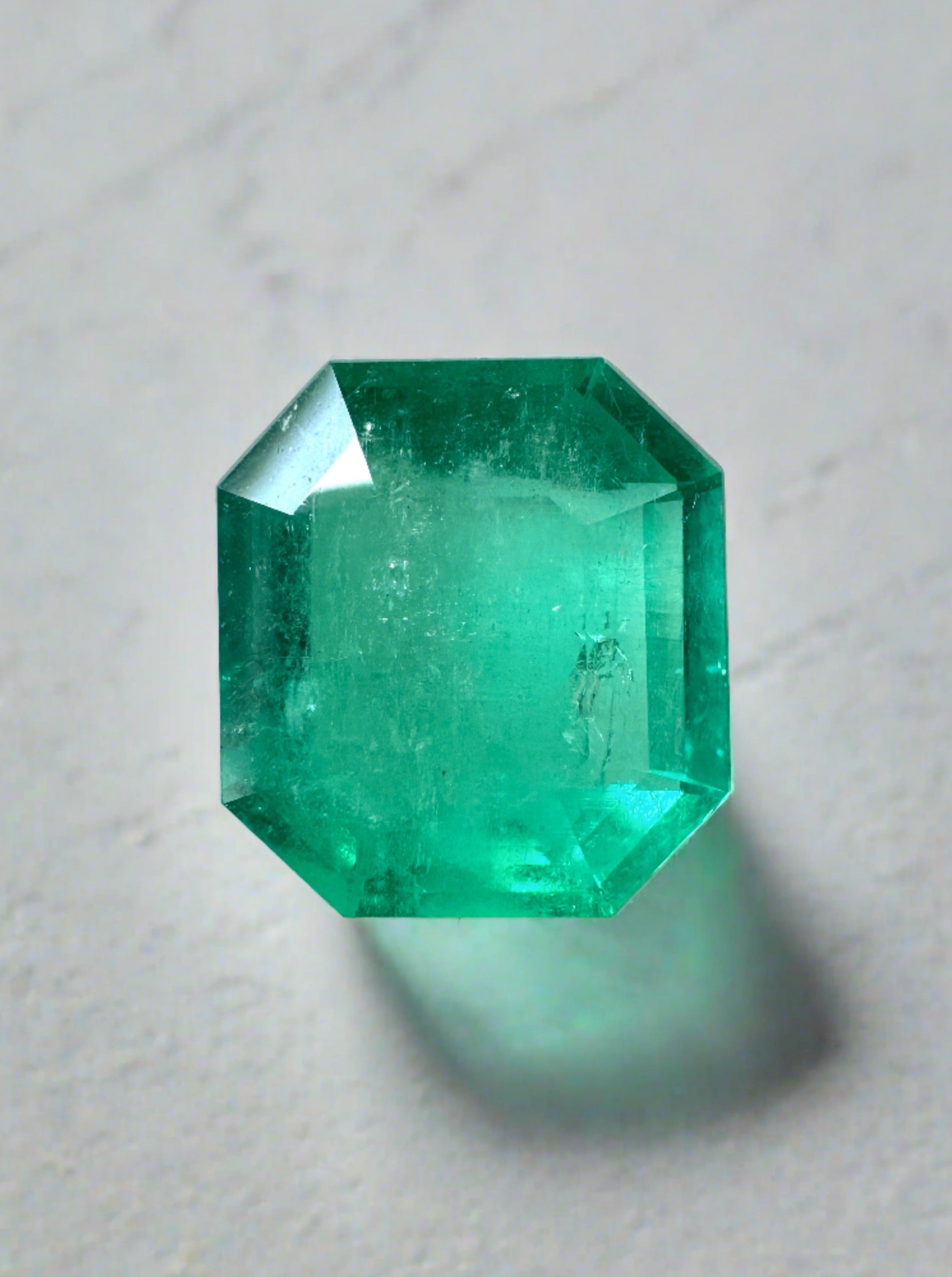 4.56-carat natural Colombian emerald loose gemstone in an emerald cut, measuring 11x10mm, showcasing vibrant green color and clarity.