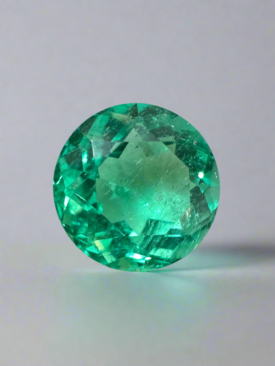Vibrant green 4.57 carat round Colombian emerald with crystalline clarity, natural gemstone from JR Colombian Emeralds.
