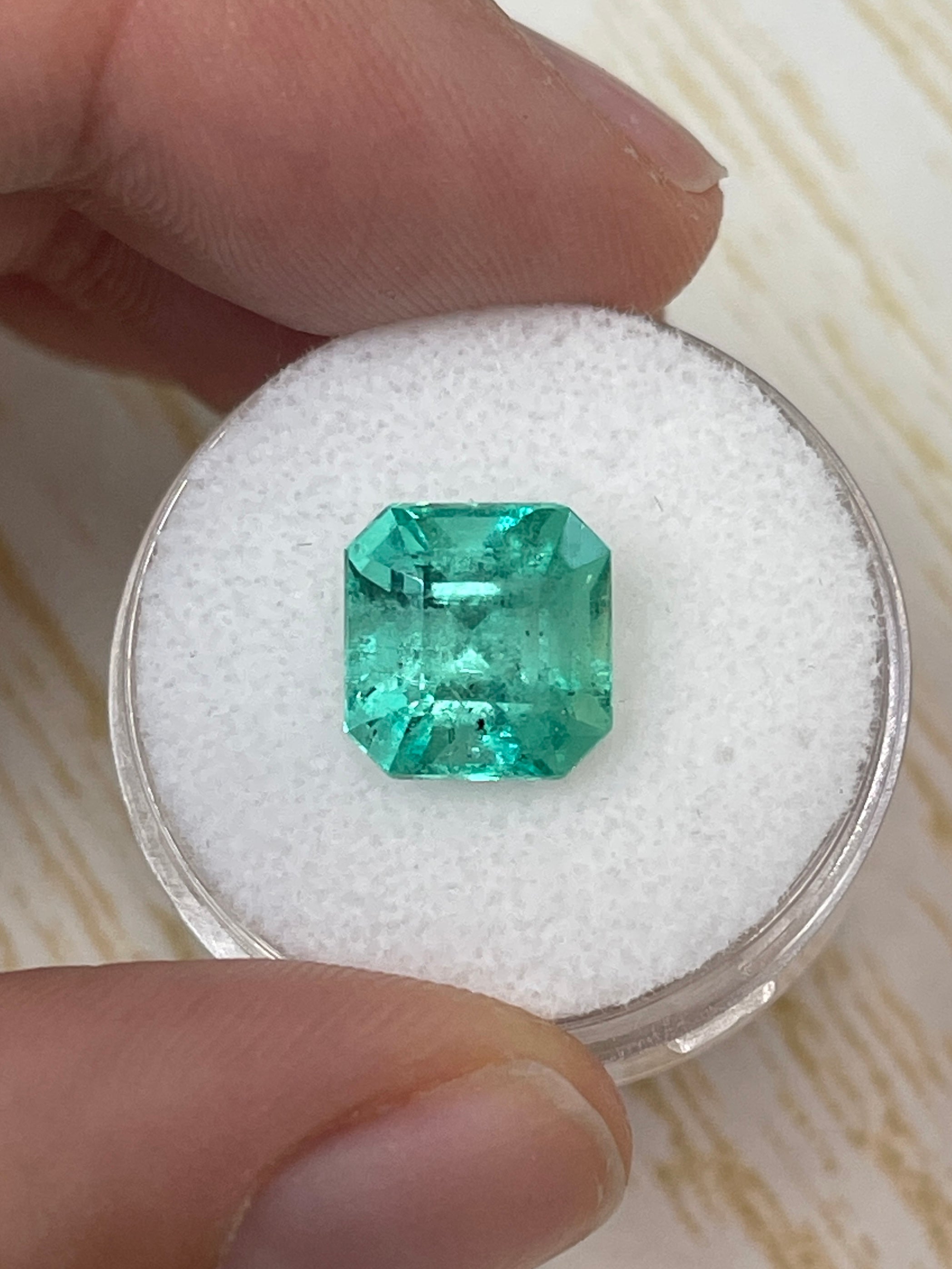4.69-carat 10x10 mm freckled Colombian Emerald Asscher cut with clipped corners, loose gemstone from JR Colombian Emeralds.