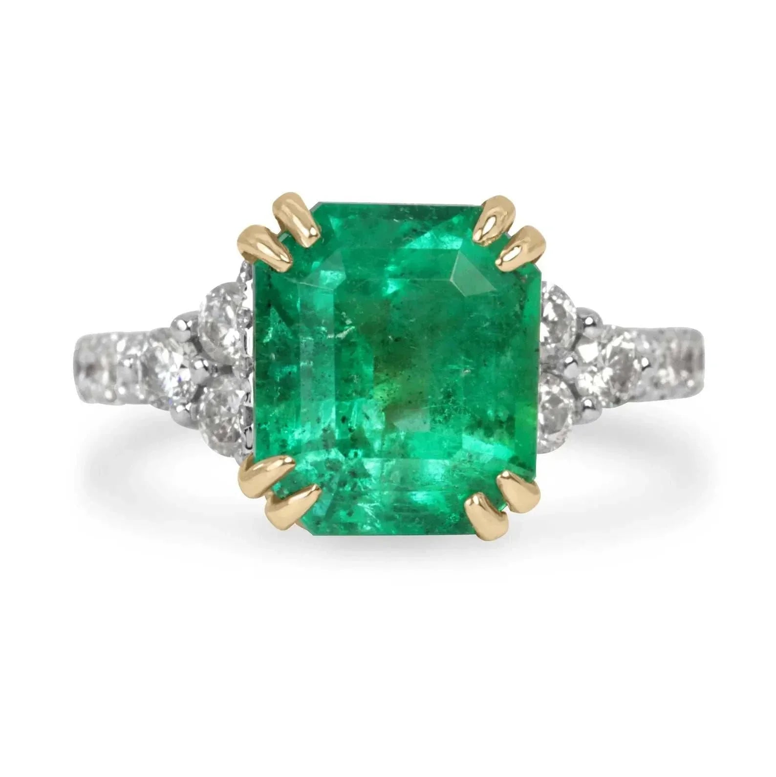 4.69tcw emerald cut Colombian emerald ring with hidden diamond halo and shank, 18K gold.